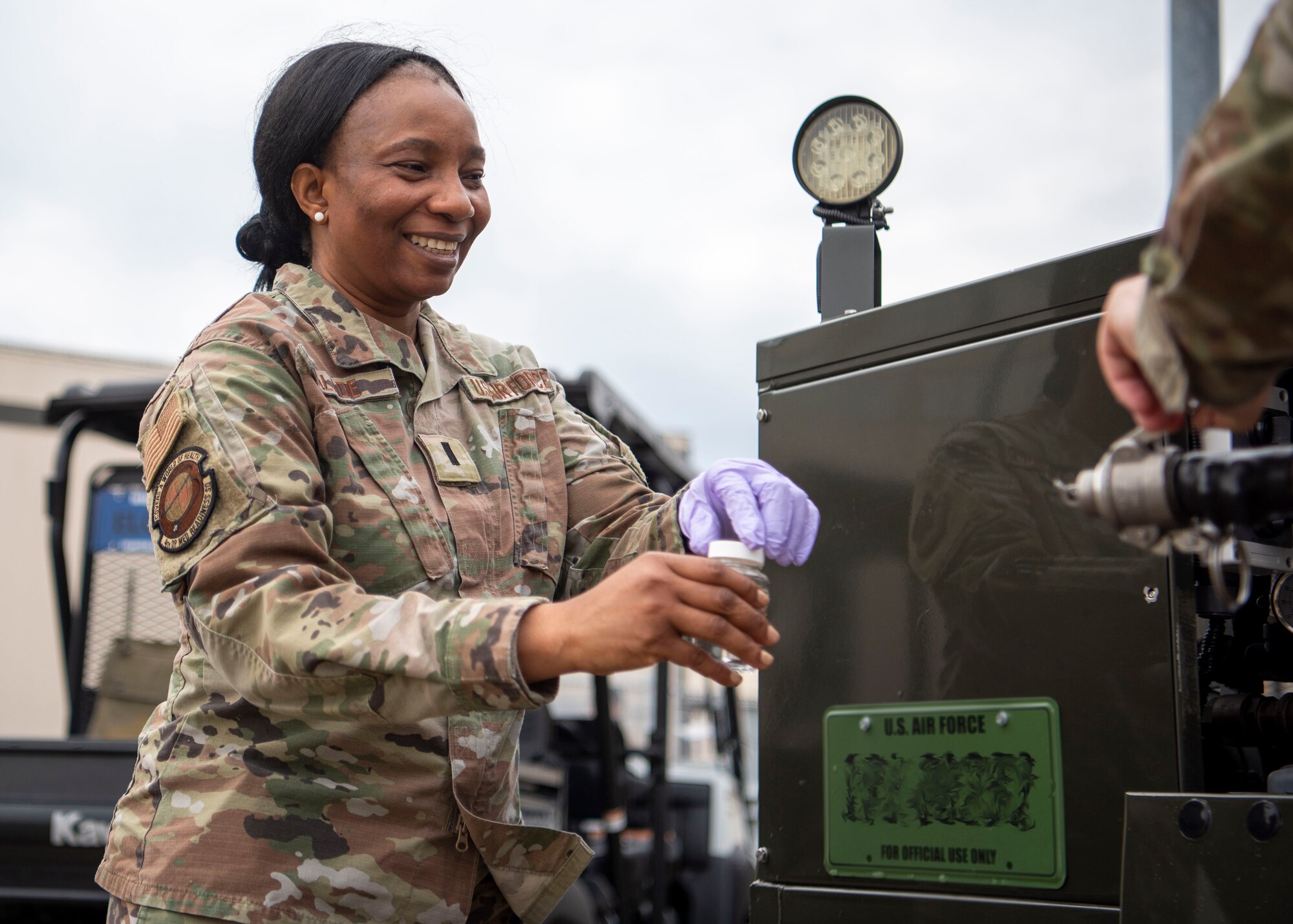 1st Lt. Yetade Alade, 4th Operational Medical Readiness Squadron bioenvironmental officer, collects a potable water sample at Seymour Johnson Air Force Base North Carolina, Feb. 16, 2022.