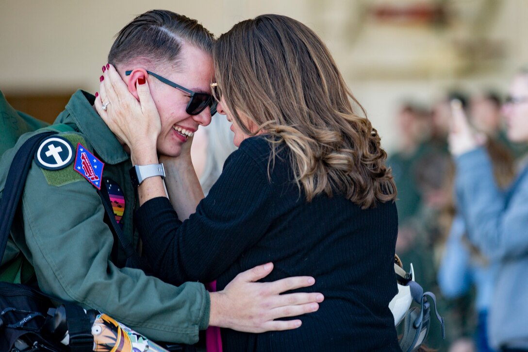 A U.S. Navy Sailor attached to Marine Medium Tiltrotor Squadron (VMM) 165 (Reinforced), 11th Marine Expeditionary Unit, greets his mother after returning from deployment on Marine Corps Air Station Camp Pendleton, California, Feb. 28, 2022.  The squadron returned from the unit’s Western Pacific 21.2 deployment in support of U.S. 3rd, 5th, and 7th Fleet area of operations as part of the Essex Amphibious Ready Group.



(U.S. Marine Corps photo by Sgt. Dana Beesley)