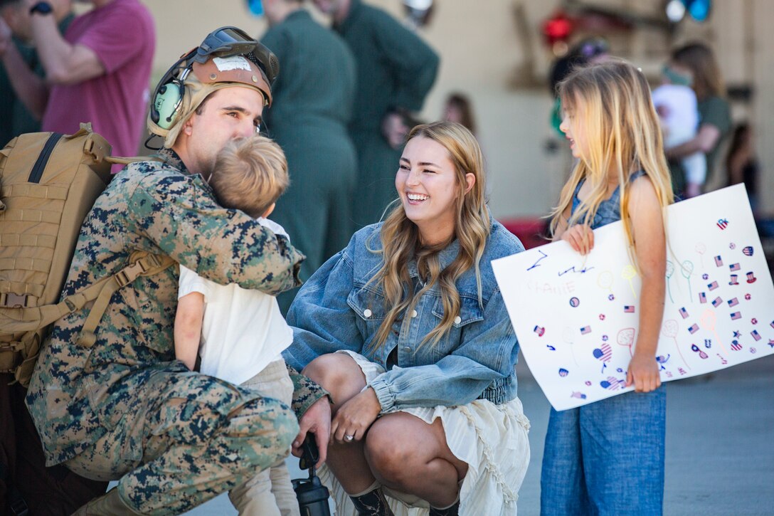 A U.S. Marine attached to Marine Medium Tiltrotor Squadron (VMM) 165 (Reinforced), 11th Marine Expeditionary Unit, greets his family during a homecoming on Marine Corps Air Station Camp Pendleton, California, Feb. 28, 2022. The squadron returned from the unit’s Western Pacific 21.2 deployment in support of U.S. 3rd, 5th, and 7th Fleet area of operations as part of the Essex Amphibious Ready Group. 



(U.S. Marine Corps photo by Sgt. Dana Beesley)