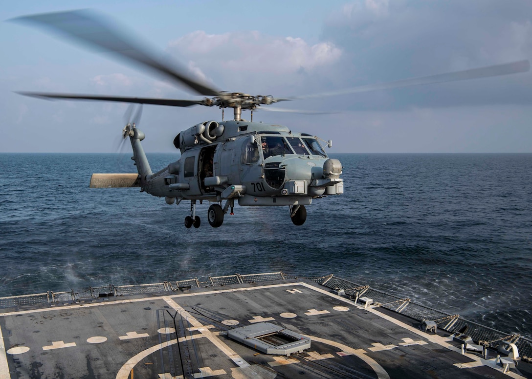 GULF OF OMAN (Feb. 28, 2022) An MH-60R Sea Hawk helicopter, attached to the “Raptors” of Helicopter Maritime Strike Squadron (HSM) 71, takes off during flight operations aboard the guided-missile destroyer USS Gridley (DDG 101) in the Gulf of Oman, Feb. 28. Gridley is deployed to the U.S. 5th Fleet area of operations in support of naval operations to ensure maritime stability and security in the Central Region, connecting the Mediterranean and Pacific through the Western Indian Ocean and three strategic choke points. (U.S. Navy photo by Mass Communication Specialist 2nd Class Colby A. Mothershead)
