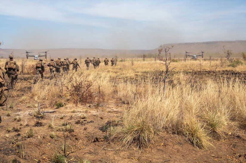 Troops move across the desert.