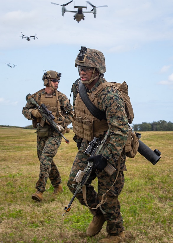 U.S. Marines with Battalion Landing Team 1/5, 31st Marine Expeditionary Unit (MEU), move toward the objective during a helicopter raid training exercise, on Ie Shima, Okinawa, Japan, Feb. 9, 2022.