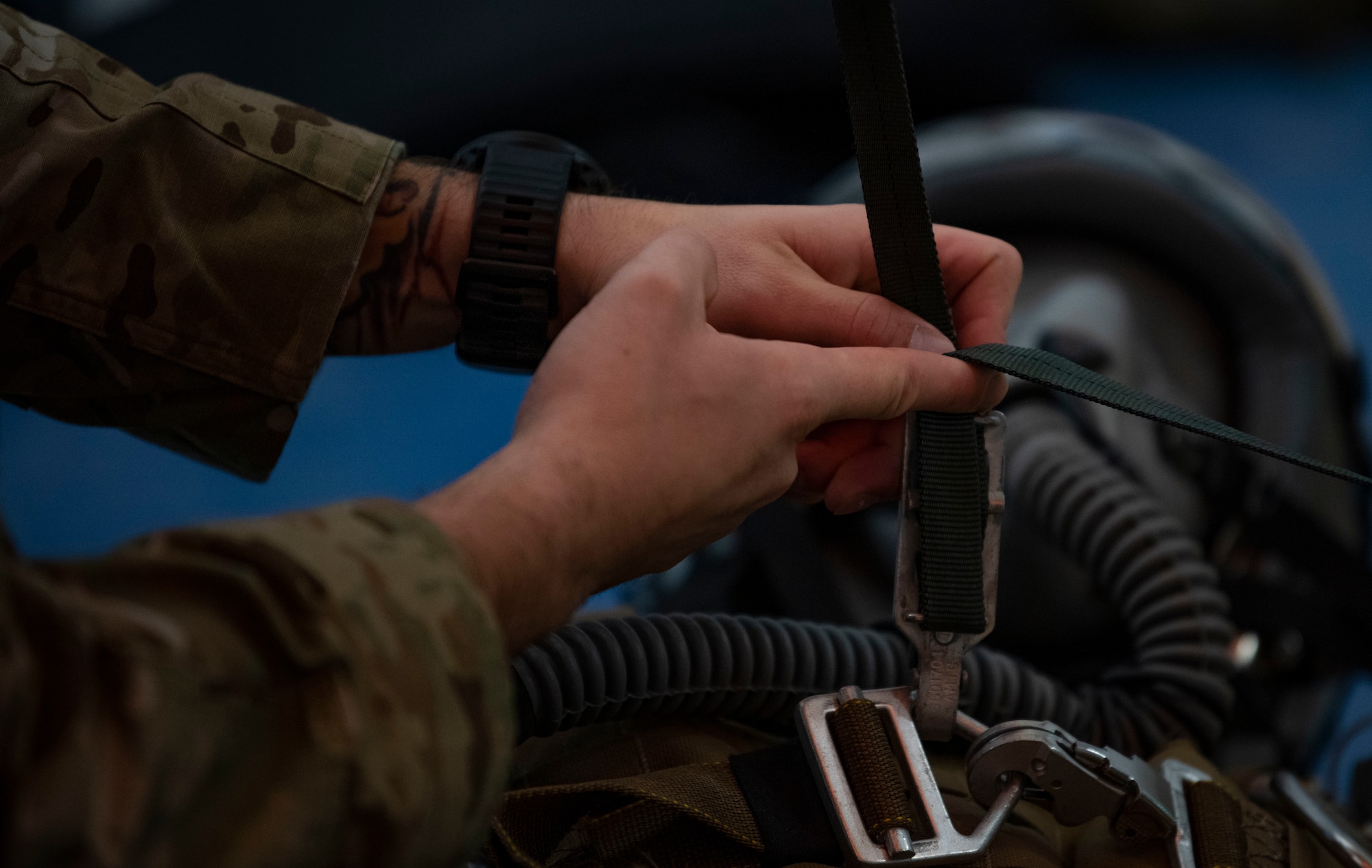U.S. Air Force Tech. Sgt. Steven Nelson, a 1st Special Operations Support Squadron Survival, Evasion, Resistance and Escape specialist, teaches students how to do corrective procedures for their parachutes during Emergency Parachute Training, Feb. 15, 2022, at Hurlburt Field, Florida.