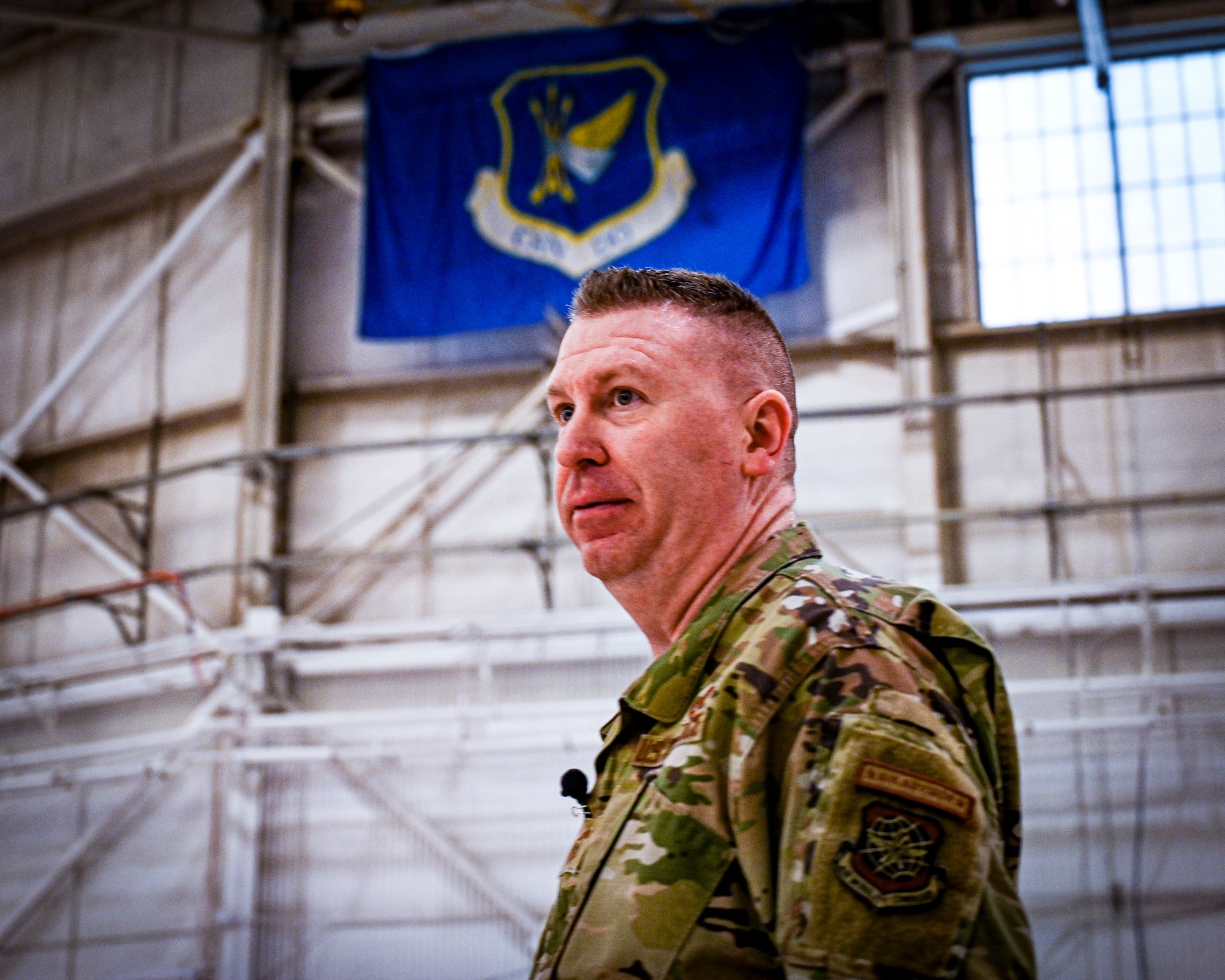 U.S. Air Force Chief Master Sgt. Chad W. Bickley, 18th Air Force, command chief, addresses Airmen during an all call on Feb. 24, 2022, at Joint Base McGuire-Dix-Lakehurst, N.J. Bickley visited the 305 Air Mobility Wing to learn how the unit contributes to the 18th Air Force airlift and aerial refueling missions, and spoke with Airmen to learn about their successes and challenges. As Air Mobility Command’s sole numbered Air Force, 18th AF is tasked with presenting trained, equipped, and ready forces for worldwide operational requirements.