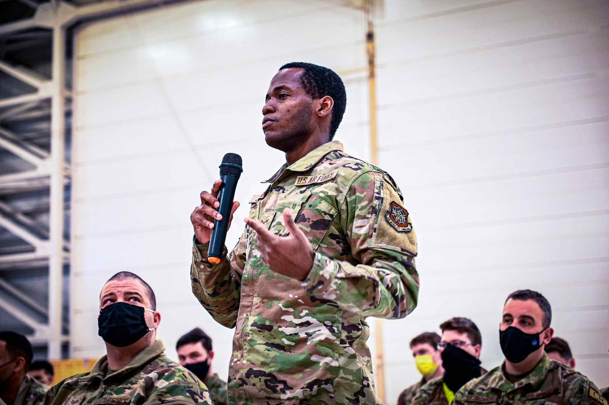 A U.S. Air Force Airman assigned to the 305th Air Mobility Wing speaks during an all call held for Chief Master Sgt. Chad W. Bickley, 18th Air Force command chief, on Feb. 24, 2022, at Joint Base McGuire-Dix-Lakehurst, N.J. Bickley visited the 305 Air Mobility Wing to learn how the unit contributes to the 18th Air Force airlift and aerial refueling missions, and spoke with Airmen to learn about their successes and challenges. As Air Mobility Command’s sole numbered Air Force, 18th AF is tasked with presenting trained, equipped, and ready forces for worldwide operational requirements.
