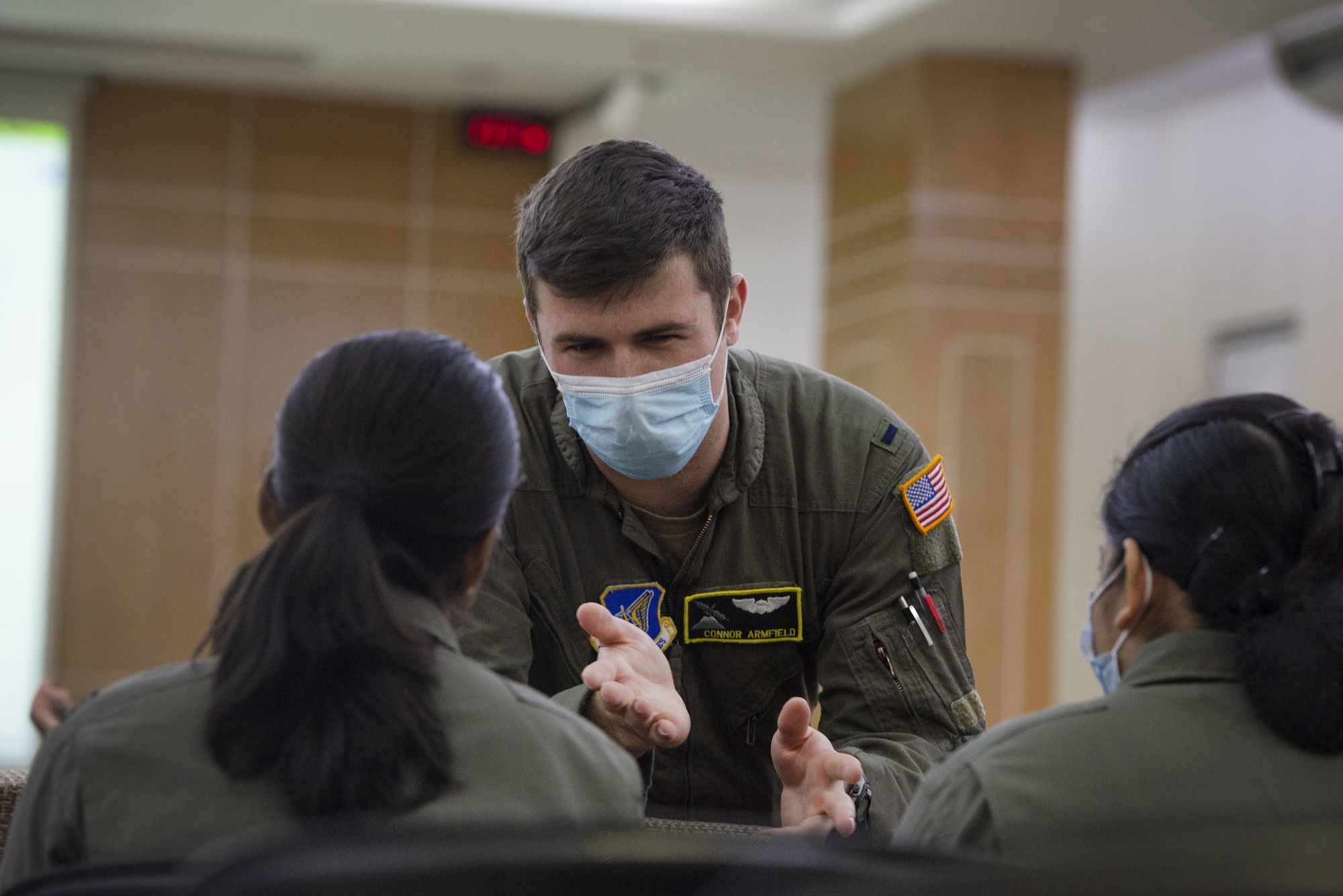 U.S. Air Force 1st Lt Connor Armfield, center, 36th Expeditionary Airlift Squadron C-130J Super Hercules pilot, talks to Bangladesh air force aircrew during a subject matter exchange event as part of Exercise Cope South 2022, Feb. 19, 2022, at BAF Kurmitola Cantonment, Bangladesh. Discussions during the SME event included best practices on low level flight, aircrew flight equipment nomenclature, C-130J Super Hercules capabilities and crew resource management. Exercise Cope South is a Pacific Air Forces-sponsored bilateral tactical airlift exercise designed to enhance the interoperability between the U.S. Air Force and BAF. (U.S. Air Force photo by Tech. Sgt. Christopher Hubenthal)
