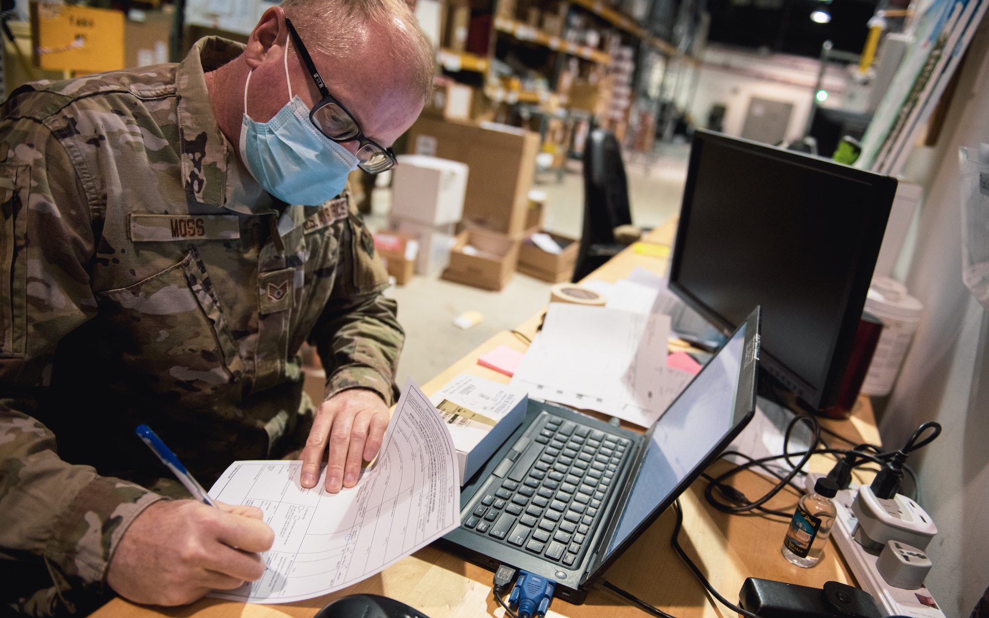 Airman signs papers.