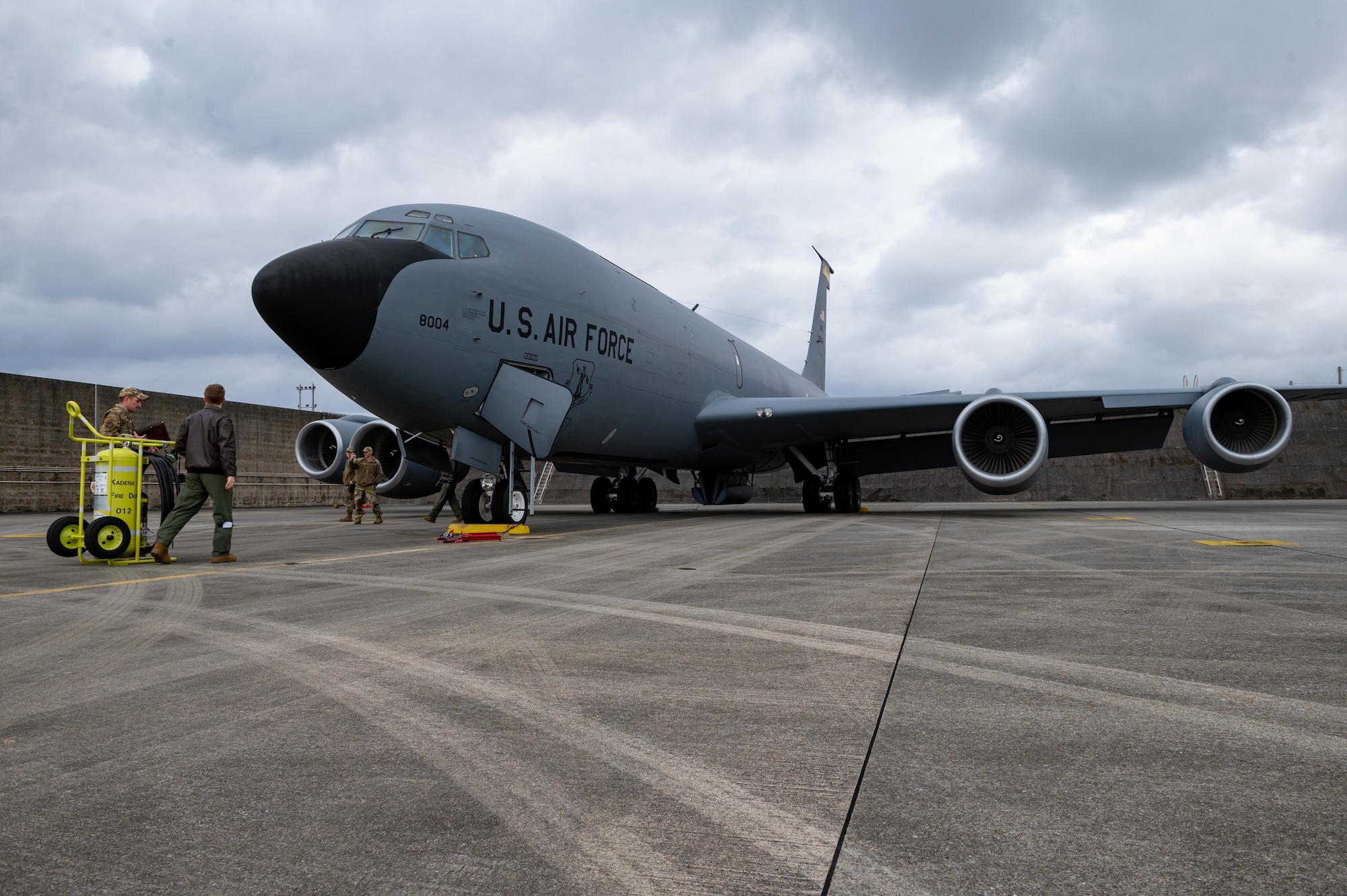 Airman conduct preflight checks on a KC-135.
