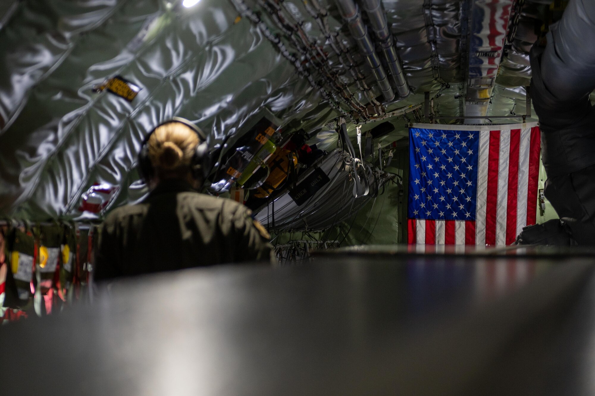 An Airman walks toward the boom pod to conduct an air refueling mission on a KC-135