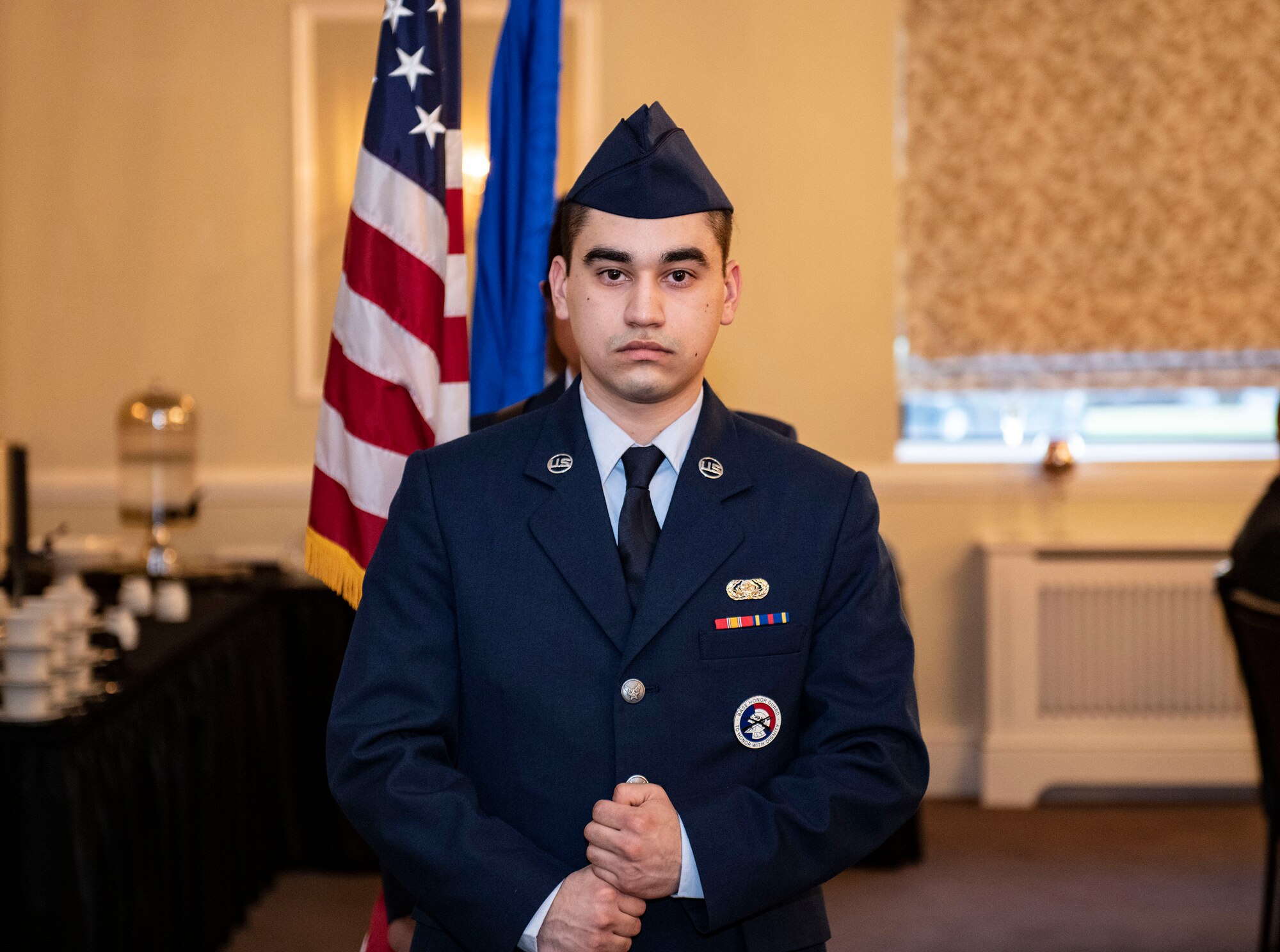 U.S. Air Force Airman Francisco Ruiz, 423rd Communications Squadron client systems apprentice, stands at attention at RAF Alconbury, England, Feb. 25, 2022. Members of the RAFA Honor Guard provided a colors detail in support of the 501st Combat Support Wing Annual Awards ceremony. (U.S. Air Force photo by Senior Airman Jason W. Cochran)