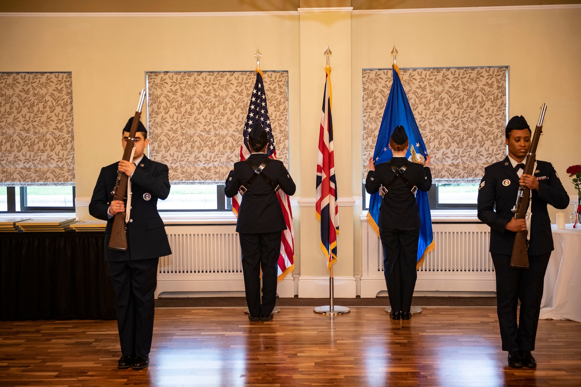 Members of 423rd Air Base Group Honor Guard present the colors at RAF Alconbury, England, Feb. 25, 2022. Members of the RAFA Honor Guard provided a colors detail in support of the 501st Combat Support Wing Annual Awards ceremony. (U.S. Air Force photo by Senior Airman Jason W. Cochran)