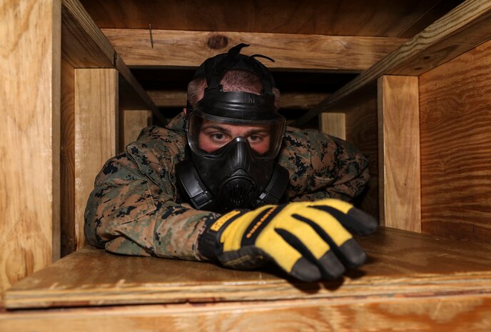 Marine Security Guard students with Marine Corps Embassy Security Group crawl through the collapsed structure trainer at Marine Corps Base Quantico, Va., Feb. 23, 2020. The special duty assignment requires Marines to go through extensive background checks, security clearances, psychological testing, and physical and academic training before graduating from MSG school.