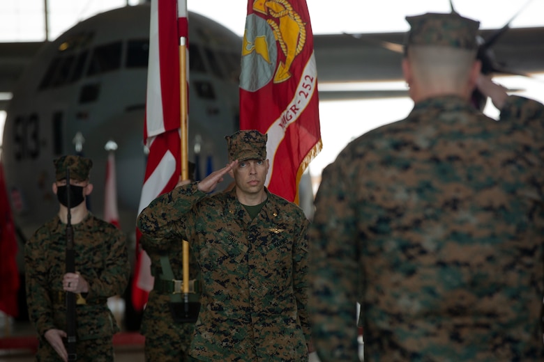 U.S. Marine Corps Maj. Corey Jones, a KC-130J Super Hercules pilot with Fleet Replacement Detachment salutes Maj. Gen. Michael Cederholm, Commanding General of 2nd Marine Aircraft Wing, during an award ceremony at Marine Corps Air Station Cherry Point, North Carolina, Feb. 28, 2022. Jones, a native of Charlotte, North Carolina, was awarded the Distinguished Flying Cross for conducting an emergency landing after another aircraft collided with his KC-130J Super Hercules. Jones’ piloting skills and timely decisions during the most critical moments of the 12 minutes from mid-air impact to landing are the reasons the entire aircrew were able to walk off of the aircraft and are alive today. (U.S. Marine Corps photo by Sgt Servante R. Coba)