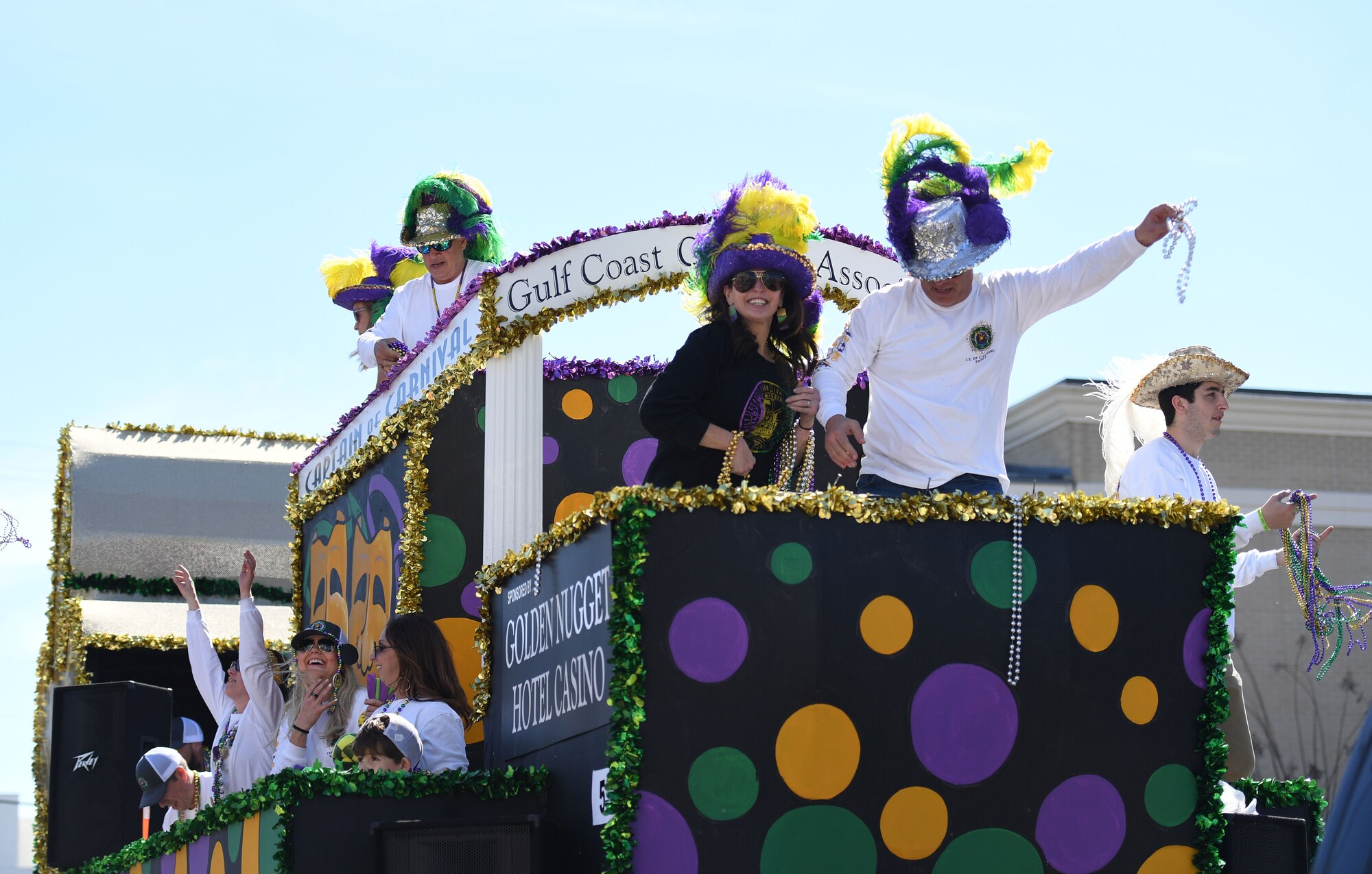Decorative floats ride through Biloxi during the Gulf Coast Carnival Association Mardi Gras parade in Biloxi, Mississippi, March 1, 2022. Keesler personnel participate in local parades every Mardi Gras season to show their support of the communities surrounding the installation. (U.S. Air Force photo by Kemberly Groue)