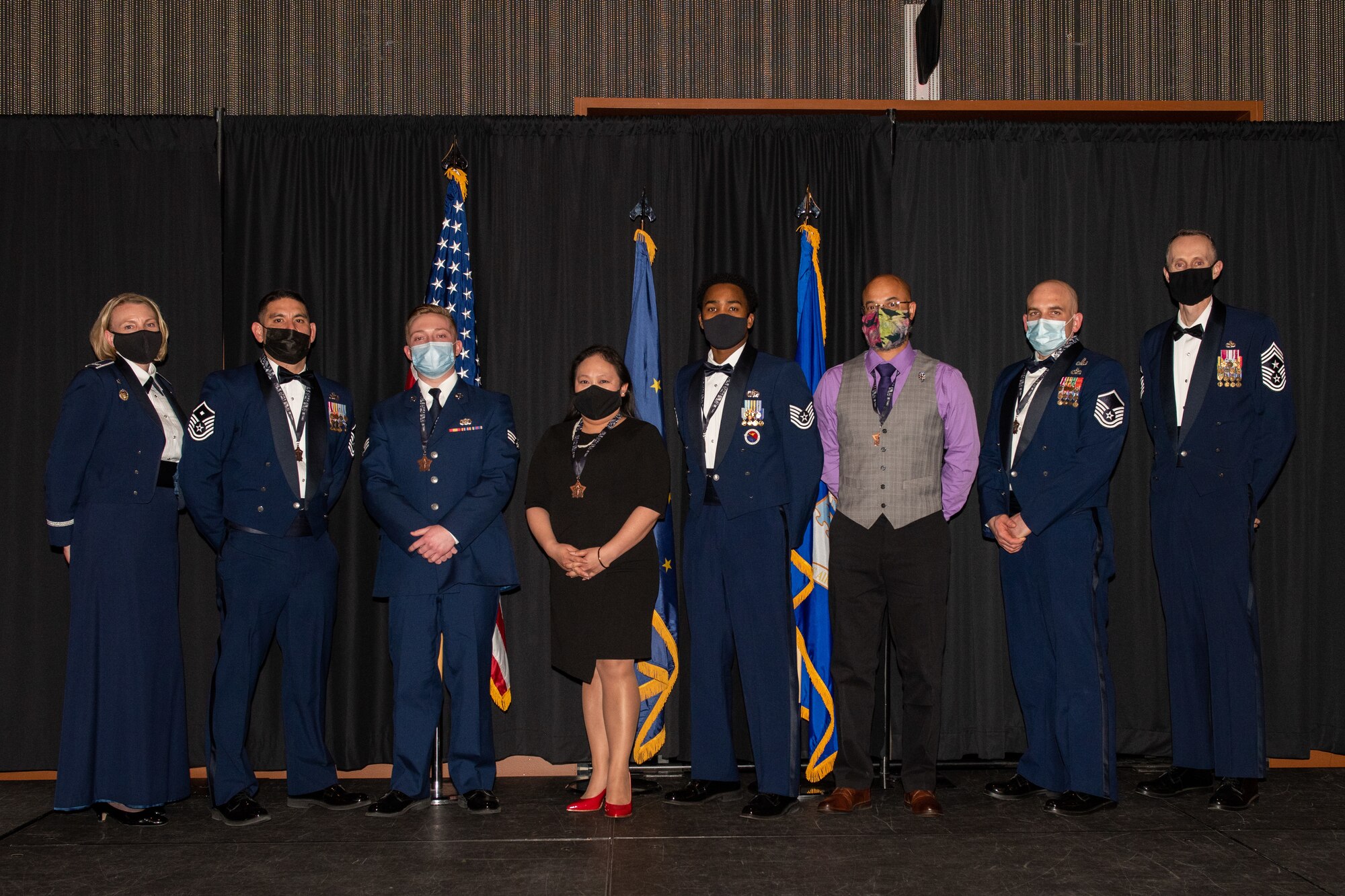 Annual Awards winners pause for a photo with 673rd Air Base Wing leadership.