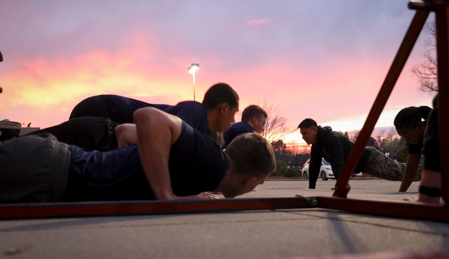U.S. Marines and poolees with Recruiting Sub Station Lexington, Recruiting Station Columbia, conduct group push-ups during their aweekly physical training session in Lexington, South Carolina, Jan. 13, 2022. Recruiters train their poolees arduously in order to ensure they are physically prepared for Marine Corps recruit training. (U.S. Marine Corps photo by Cpl. Dylan Walters)