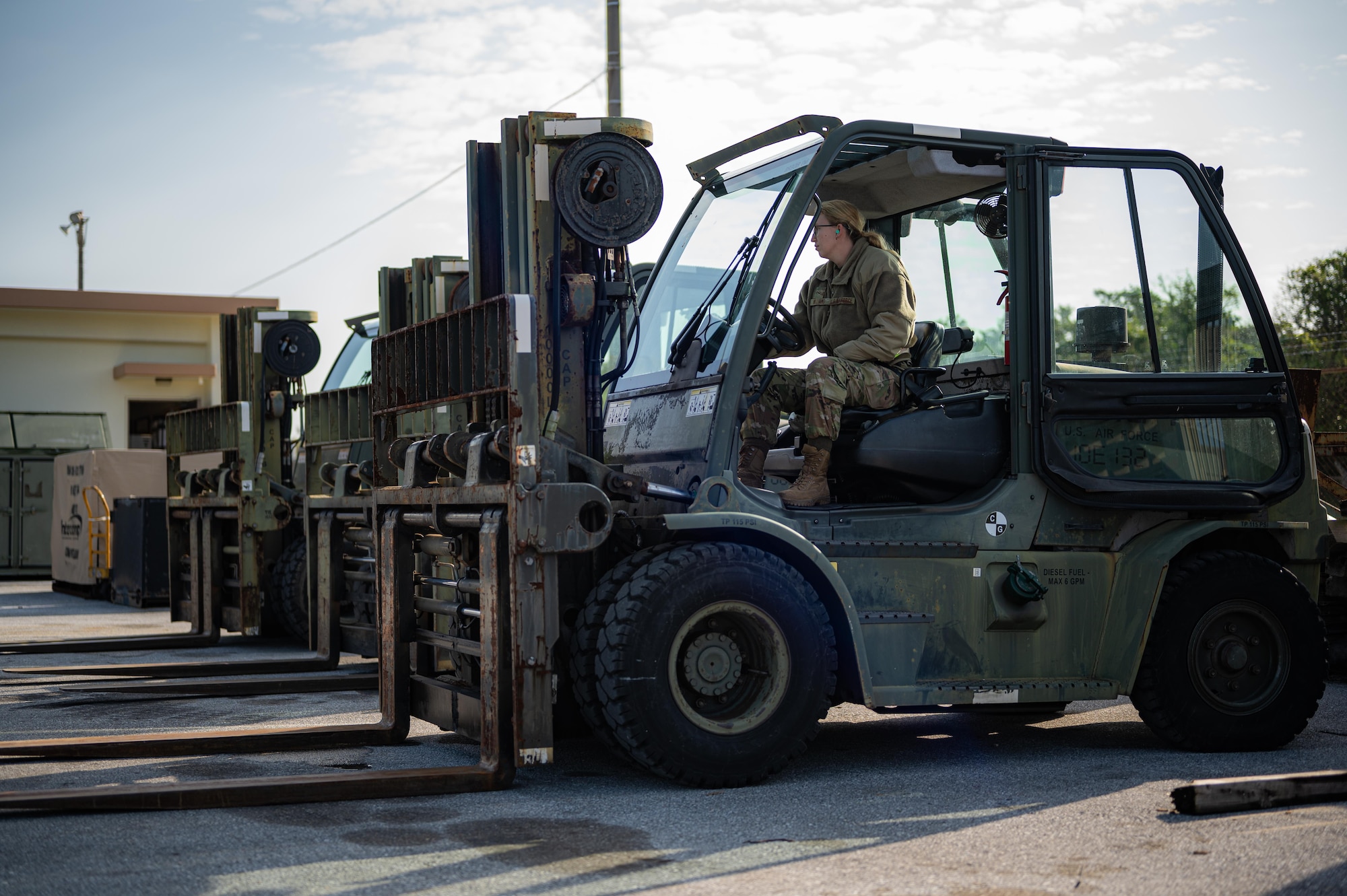 Airman parks forklift.