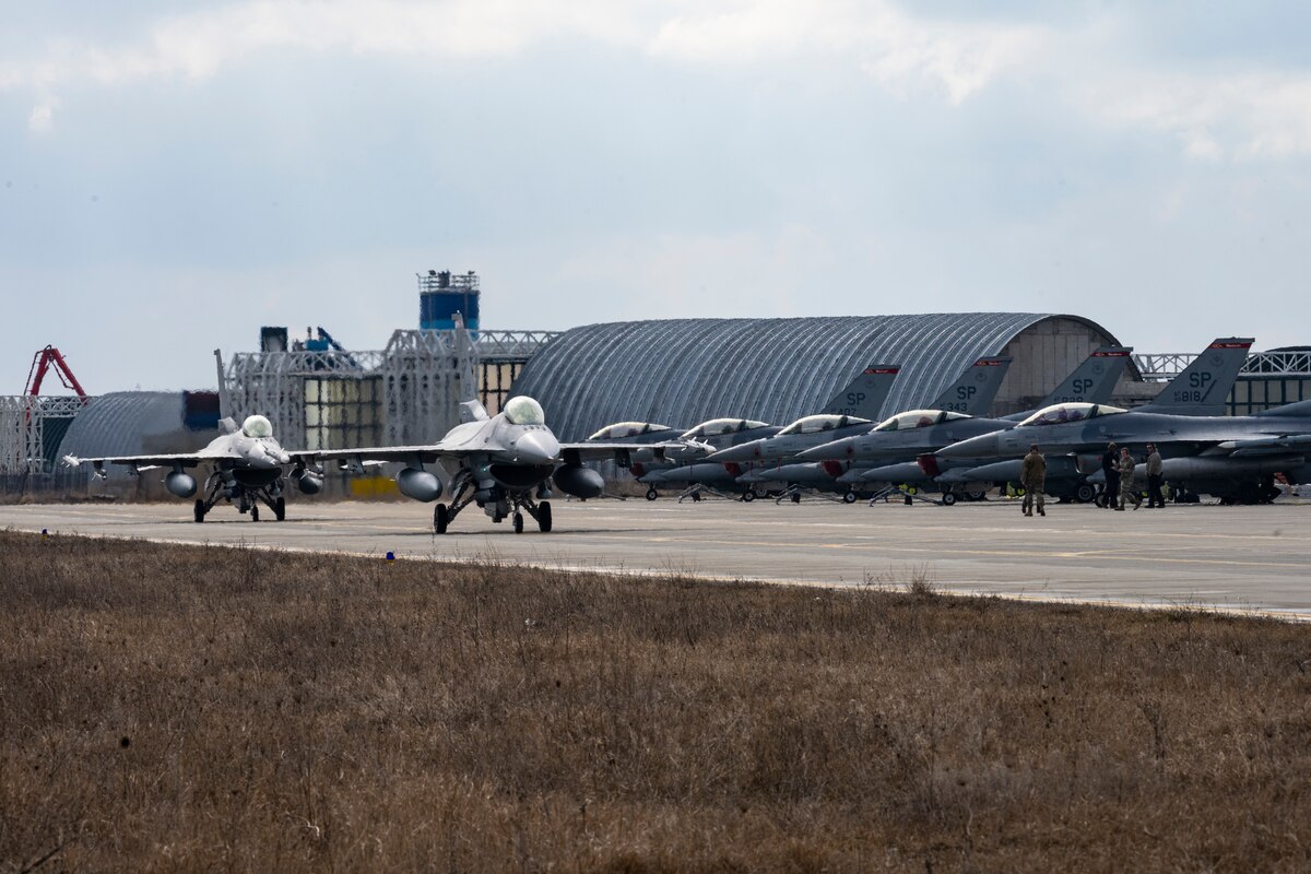 Jets line up on runway.