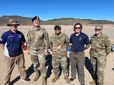 Air Force recruiters pose for a photo in Phoenix where one competed in a marksmanship competition.