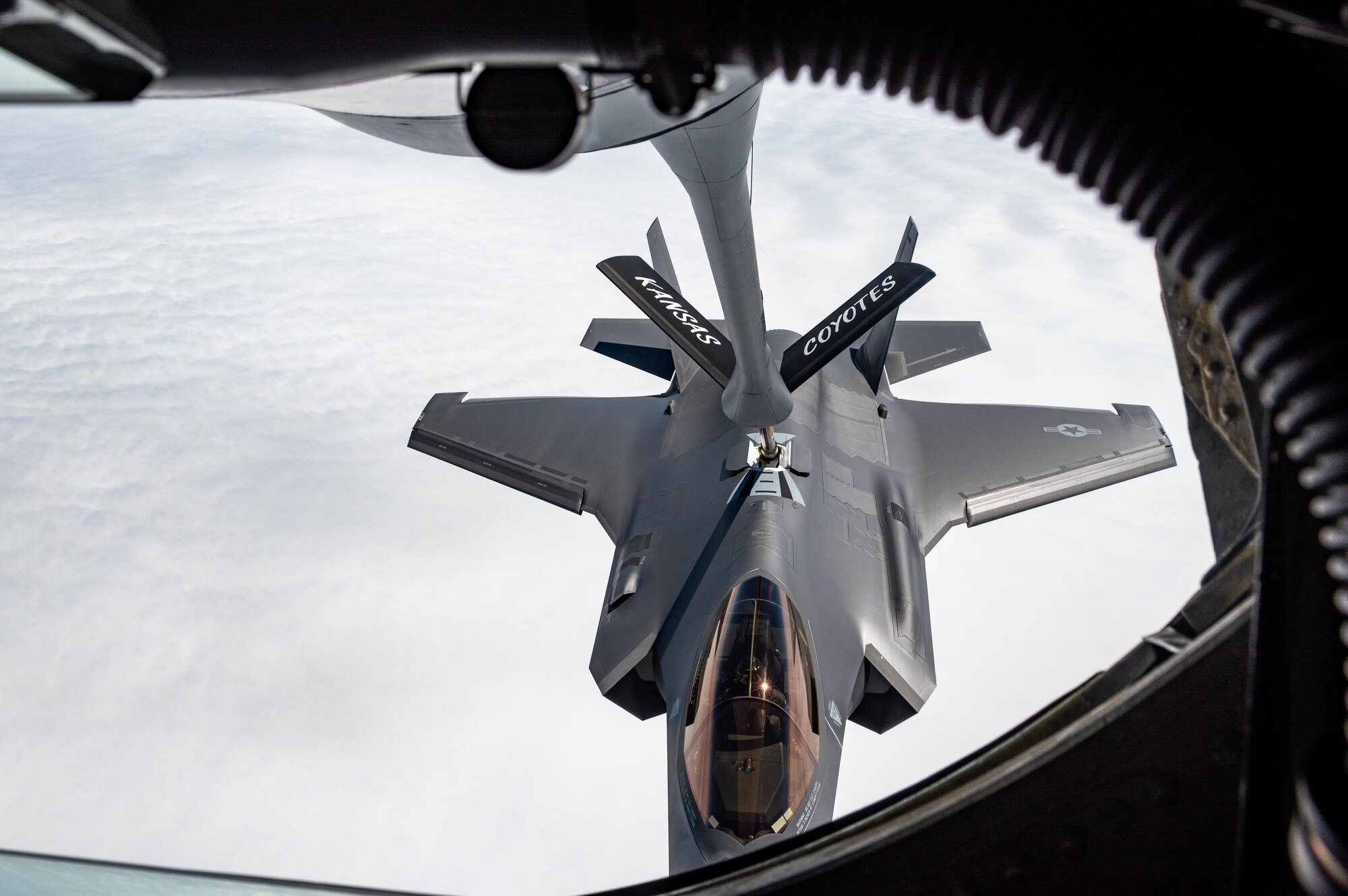 An F-35A Lightning II receives fuel from a KC-135 Stratotanker