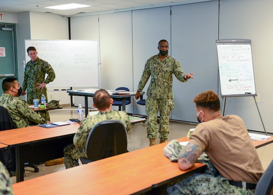 FORT WORTH, Texas (Feb. 16, 2022) - Navy Reserve Region Readiness and Mobilization Command Fort Worth Adaptive Mobilization Department Leading Chief Petty Officer Erick Okewa gives individual augmentee (IA) and mobilization-processing guidance to active-component and Selected Reserve (SELRES) Sailors during an adaptive mobilization-enabling event at REDCOM FW. The event, which occurred February 14-18, was observed by Expeditionary Combat Readiness Center assessors, who certified REDCOM FW as a Navy mobilization processing site with delegated Local Area Coordinator for Mobilization (LACMOB) authority. (U.S. Navy photo by Mass Communication Specialist 1st Class Lawrence Davis)