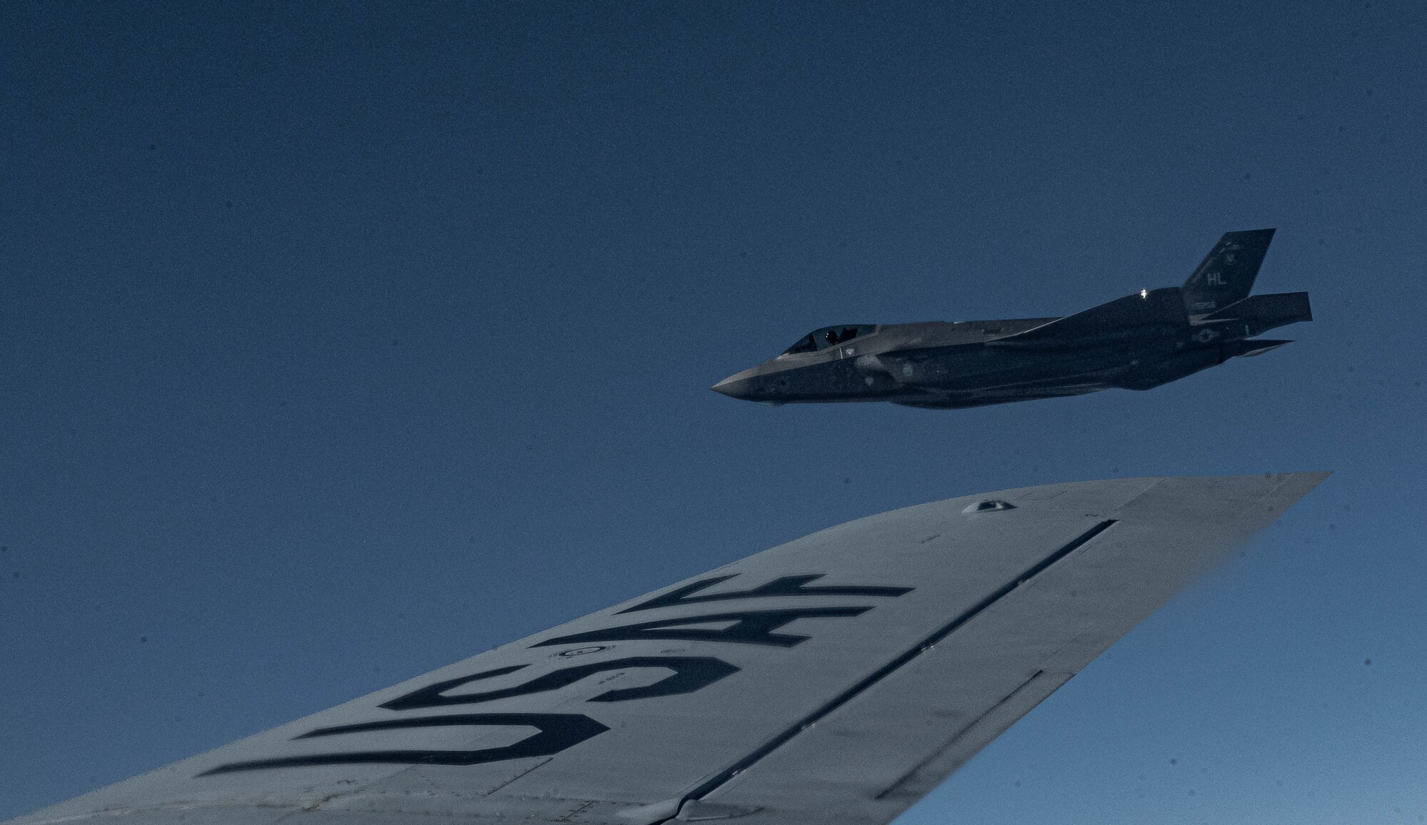 jet fly's next to aircraft