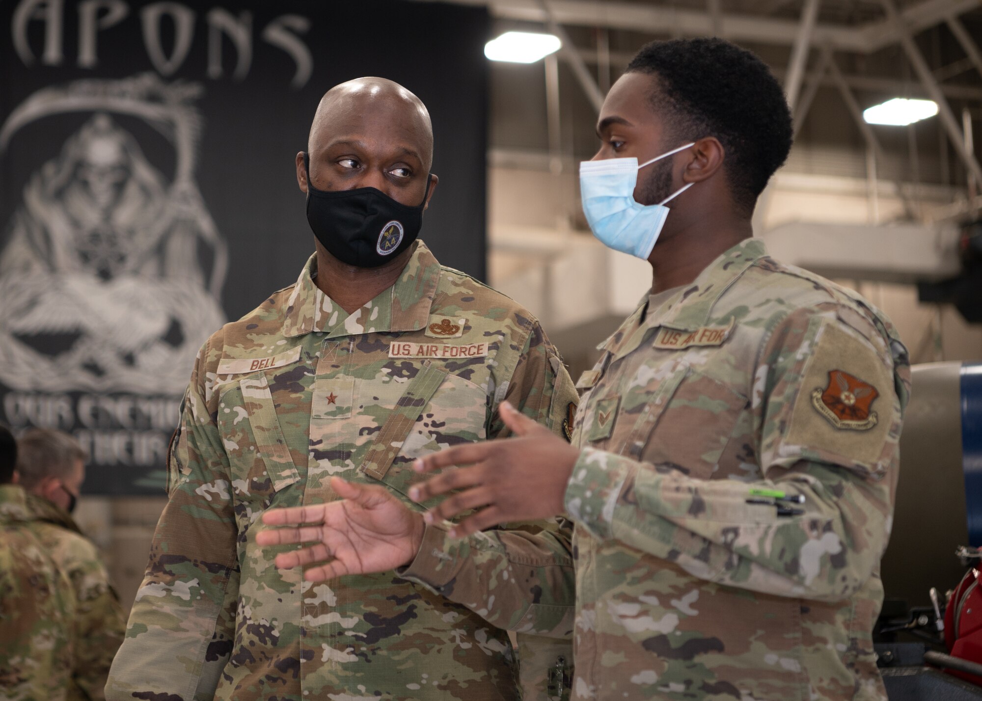 Brig. Gen. Kenyon Bell talks with Senior Airman Mark Minor about the weapons the B-2 uses.