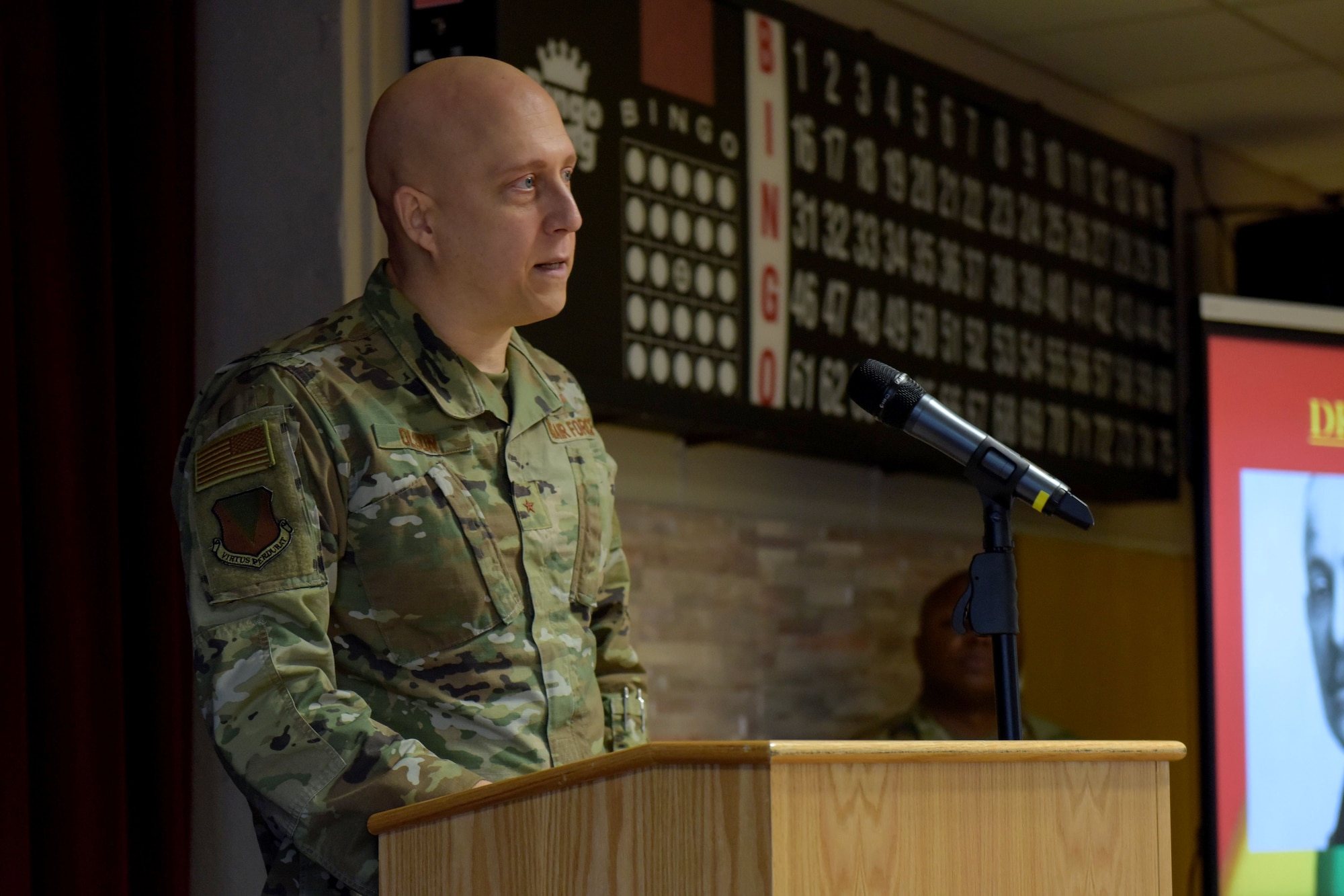 Brig. Gen. Josh Olson speaks at a podium