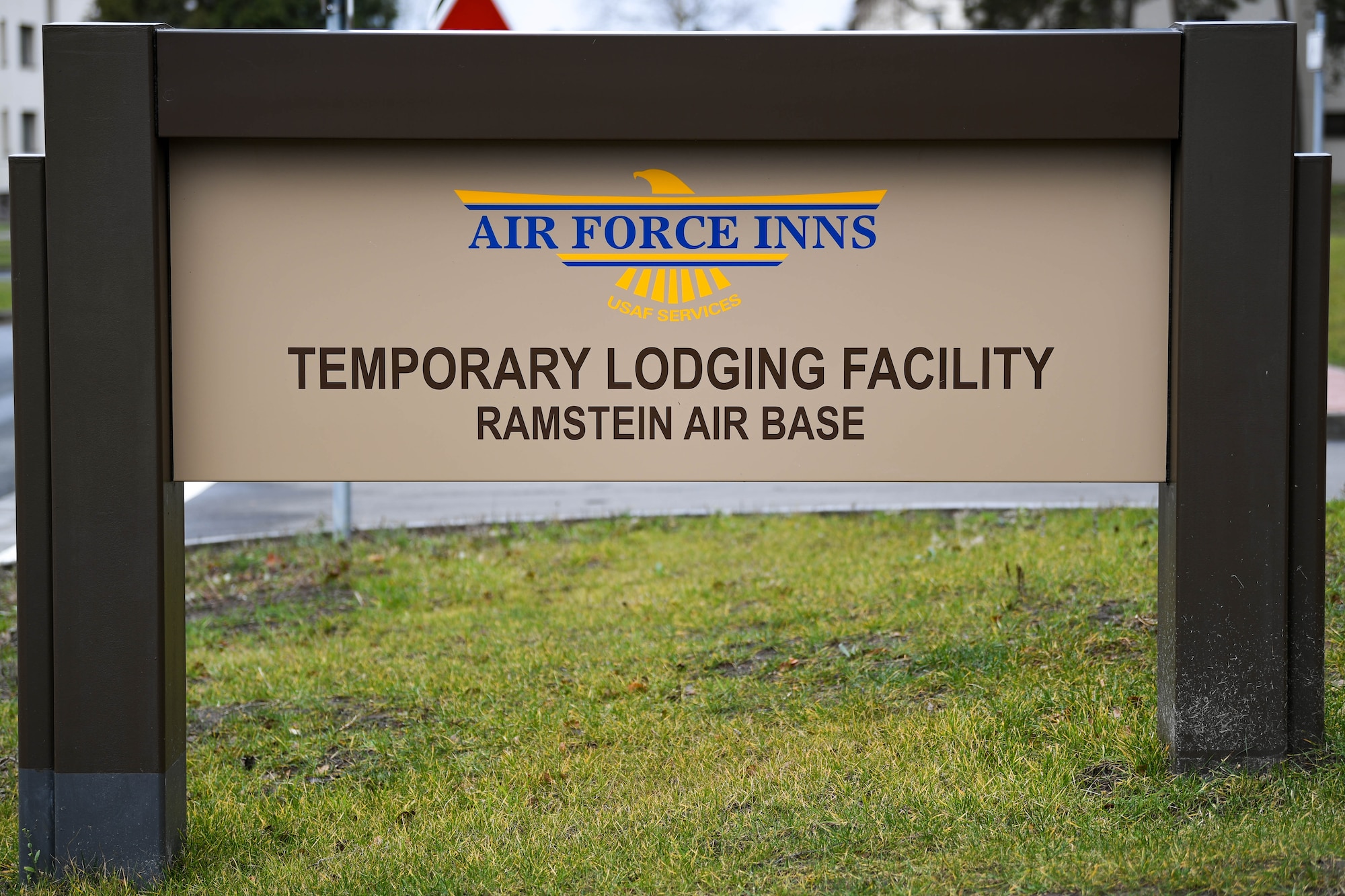 A sign for a new temporary lodging facility is displayed at Ramstein Air Base, Germany, Feb. 23, 2022. In addition to providing more lodging for PCSing families, the TLF increases Ramstein’s ability to host transit personnel and temporarily deployed units on the installation. (U.S. Air Force photo by Airman 1st Class Jared Lovett)