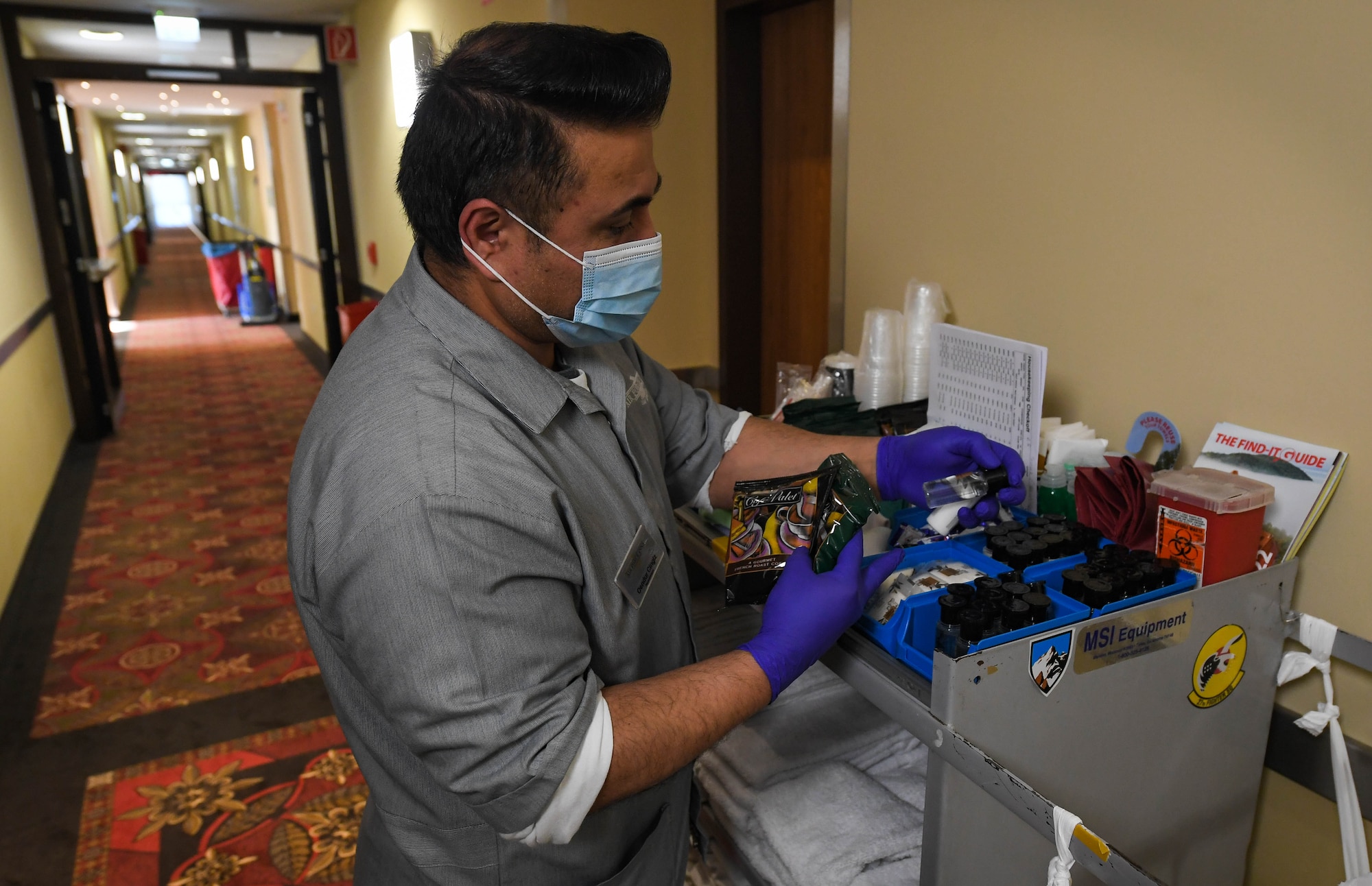 Oender Cingiz, 786th Force Support Squadron housekeeper, gathers amenities to restock a room for a guest at a new temporary lodging facility at Ramstein Air Base, Germany, Feb. 23, 2022. The TLF offers 70 two-bedroom family-units with a fully furnished kitchen, bathroom and underfloor-heating, also the house keepers provide guests with extra amenities as requested. (U.S. Air Force photo by Airman 1st Class Jared Lovett)