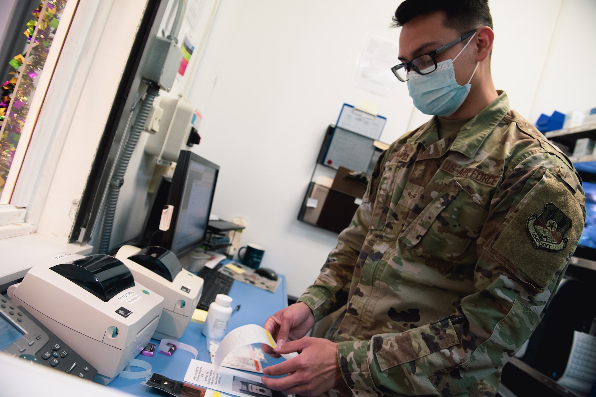 Airman checks labels.
