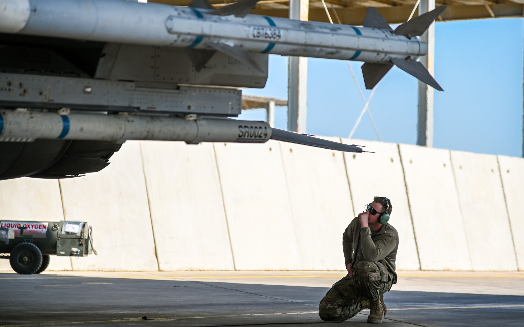 U.S. Air Force Airman 1st Class Trace Cannon, 378th Expeditionary Maintenance Squadron crew chief, conducts pre-flight checks for an F-16 Fighting Falcon at King Abdulaziz Air Base, Kingdom of Saudi Arabia, Feb. 13, 2022. Service members from the U.S., KSA, Pakistan and Bahrain conducted combined operations to better integrate partner capabilities. (U.S. Air Force photo by Staff Sgt. Christina A. Graves)