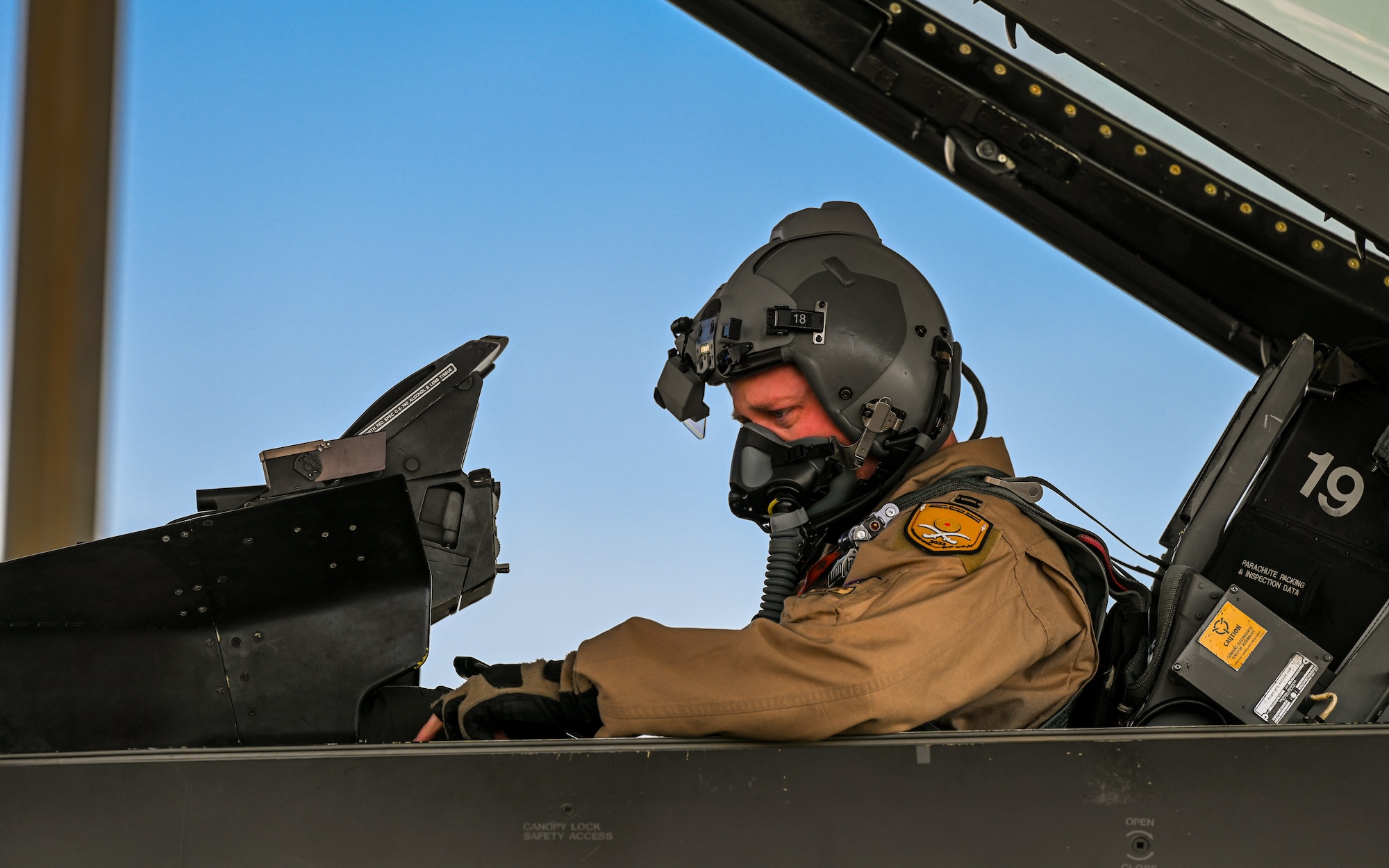 A 176th Expeditionary Fighter Squadron pilot, sits in the cockpit of an F-16 Fighting Falcon before take off at King Abdulaziz Air Base, Kingdom of Saudi Arabia, Feb. 14, 2022. The intensive and realistic combat training was conducted over the course of ten days and included live threat emitters as well as adversary aircraft. (U.S. Air Force photo by Staff Sgt. Christina A. Graves)