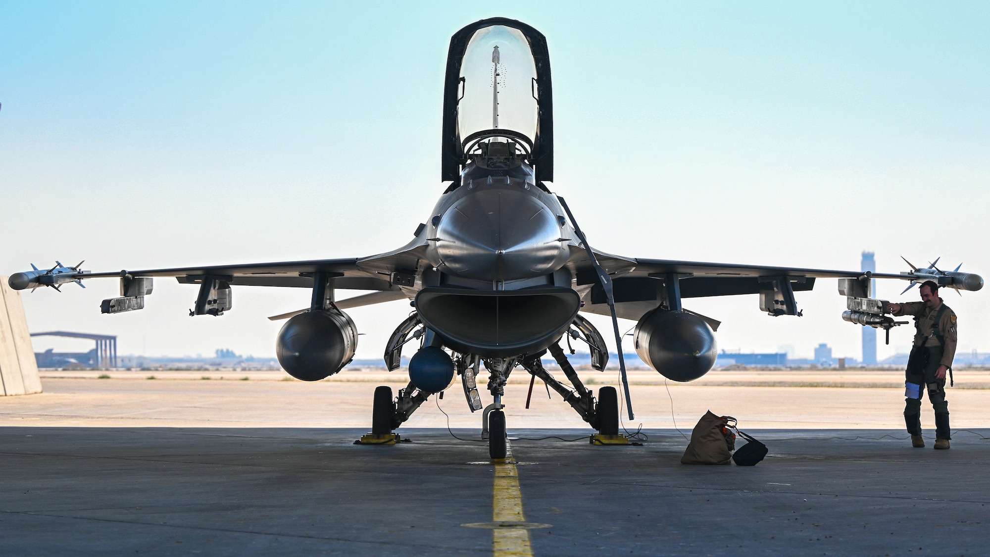 A 176th Expeditionary Fighter Squadron pilot, performs a walk around of an F-16 Fighting Falcon before take off at King Abdulaziz Air Base, Kingdom of Saudi Arabia, Feb. 16, 2022. Spears of Victory is a multinational large force air exercise led by the Royal Saudi Air Force. (U.S. Air Force photo by Staff Sgt. Christina A. Graves)