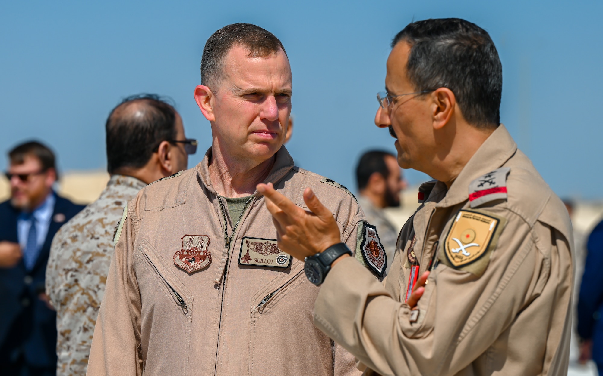 Lt. Gen. Gregory M. Guillot, Ninth Air Force (Air Forces Central) commander, speaks with Lt. Gen. Turki bin Bandar bin Abdulaziz, Royal Saudi Air Force commander, during the multinational RSAF led exercise, Spears of Victory at King Abdulaziz Air Base, Kingdom of Saudi Arabia, Feb. 17, 2022. Training with partner nations strengthens military-to-military relationships, improves interoperability and promotes regional stability. (U.S. Air Force photo by Staff Sgt. Christina A. Graves)