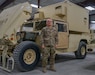 Chief Warrant Officer 4 Tracy Steele, maintenance officer for 2-104th General Support Aviation Battalion, poses next to a High Mobility Multipurpose Wheeled Vehicle on February 8, 2022. Steele is set to retire in March after serving in the Pennsylvania National Guard for more than 43 years.