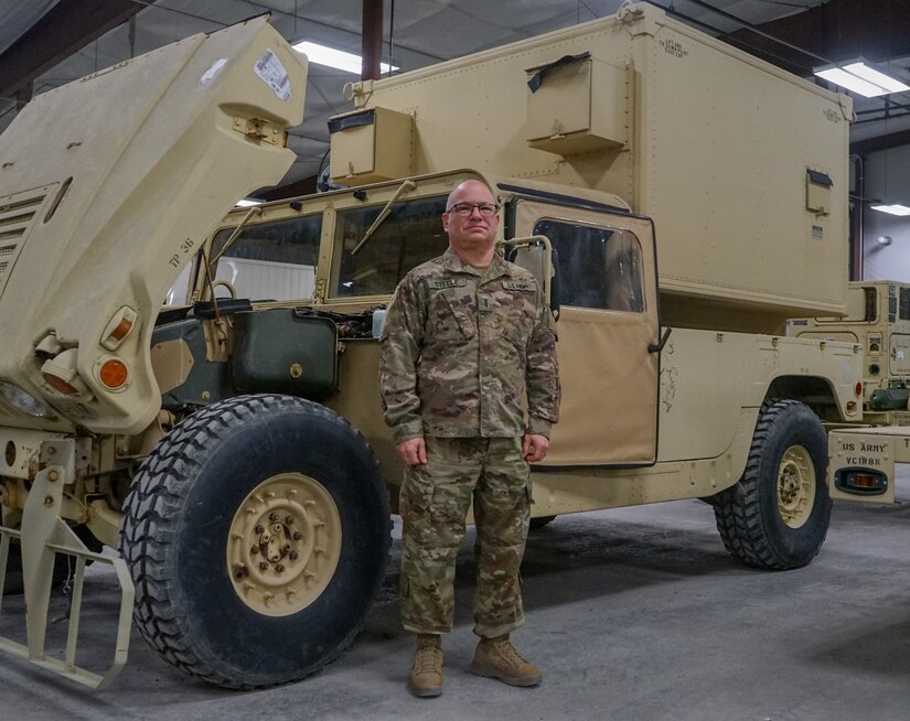 Chief Warrant Officer 4 Tracy Steele, maintenance officer for 2-104th General Support Aviation Battalion, poses next to a High Mobility Multipurpose Wheeled Vehicle on February 8, 2022. Steele is set to retire in March after serving in the Pennsylvania National Guard for more than 43 years.