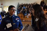 Female Coast Guard petty officer having a conversation with a potential recruit