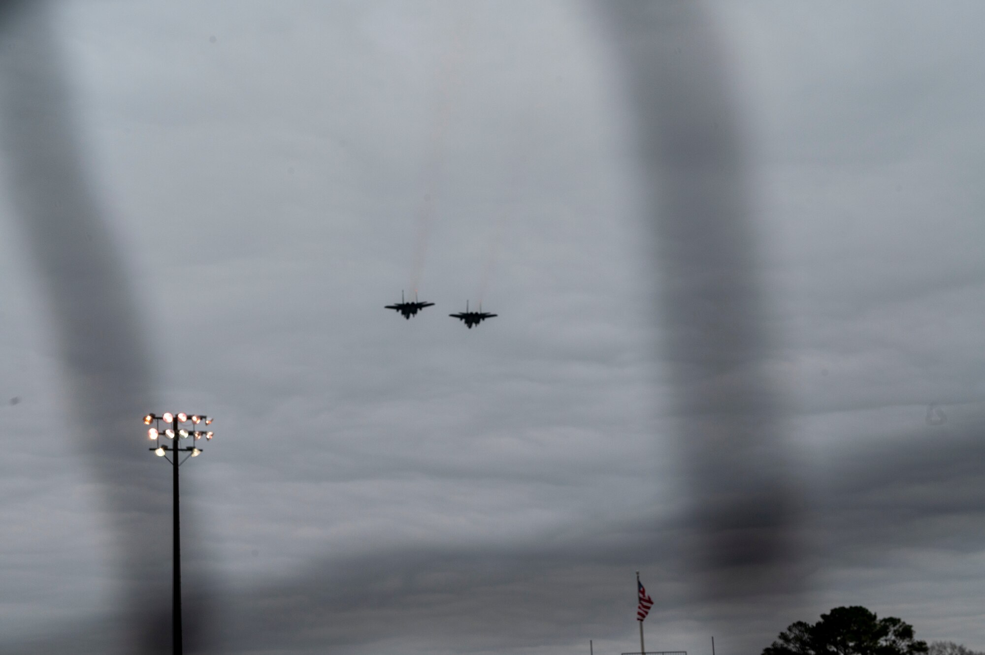 Two F-15E Strike Eagles assigned to Seymour Johnson Air Force Base fly over the 12th Annual Freedom Classic baseball series at Grainger Stadium in Kinston, North Carolina, Feb. 26, 2022. This was the second day that was part of a three-day series between the U.S. Air Force Academy and the U.S. Naval Academy. (U.S. Air Force photo by Airman 1st Class Kevin Holloway)