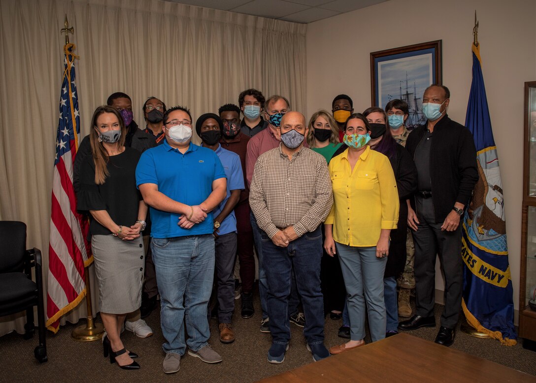 The Information Management and Customer Support Branch (Code 1042) from Naval Surface Warfare Center Panama City Division (NSWC PCD) is a 46-person team that resiliently provides full-range information technology (IT) support. This team demonstrated flexibility, teamwork, and proficiency as they collaborated to complete the monumental task of providing a technology refresh to more than 2,300 seats and were recognized during a presentation receiving a corporate operations business excellence service star award and a special challenge coin on February 9. (U.S. Navy photo by Eddie Green)

Awardees:
Code 1042 - Greg Brakey, Denise Lassiter, Heather Deich, Shelby Lium, Philippe Whitted, Marcus Maddison, Steven A. Hunt, Jeremy Coleman, John Lurry

Code 104 - Anthony Johnson, Jordan Moody; CLIN 54 - Steven Elliott, Justin Horn

Facilities (102) - Chris Owens