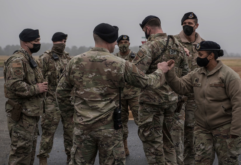 U.S. Air Force Lt. Col. Lidia Iyassu, 633d Security Forces Squadron commander, congratulates her Airmen after a job well done following a gate runner exercise at Joint Base Langley-Eustis, Virginia, Feb. 25, 2022.