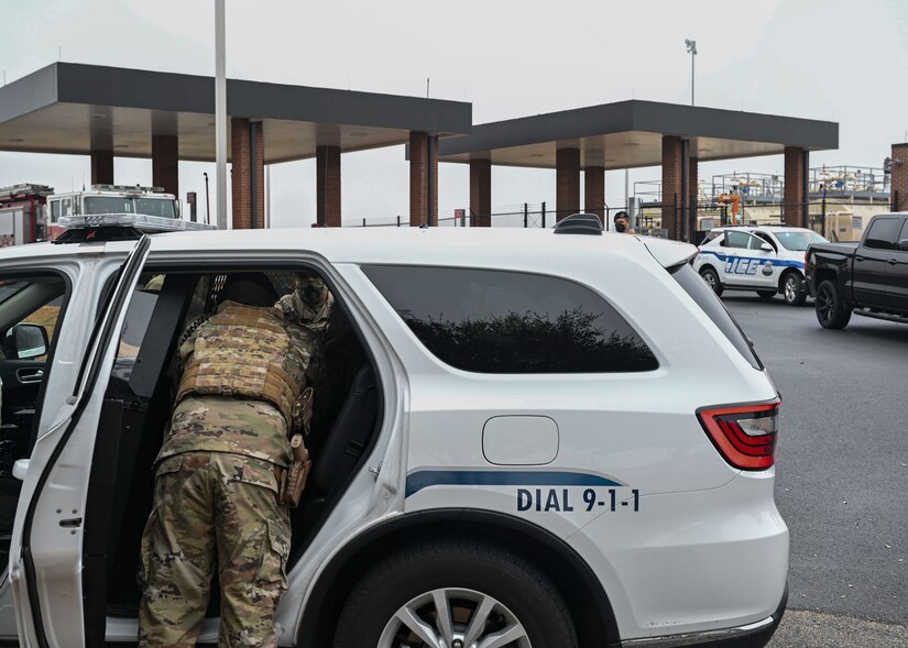 irmen from the 633d Security Forces Squadron detain a simulated combatant during a mock gate runner exercise at Joint Base Langley-Eustis, Va., Feb. 25, 2022.