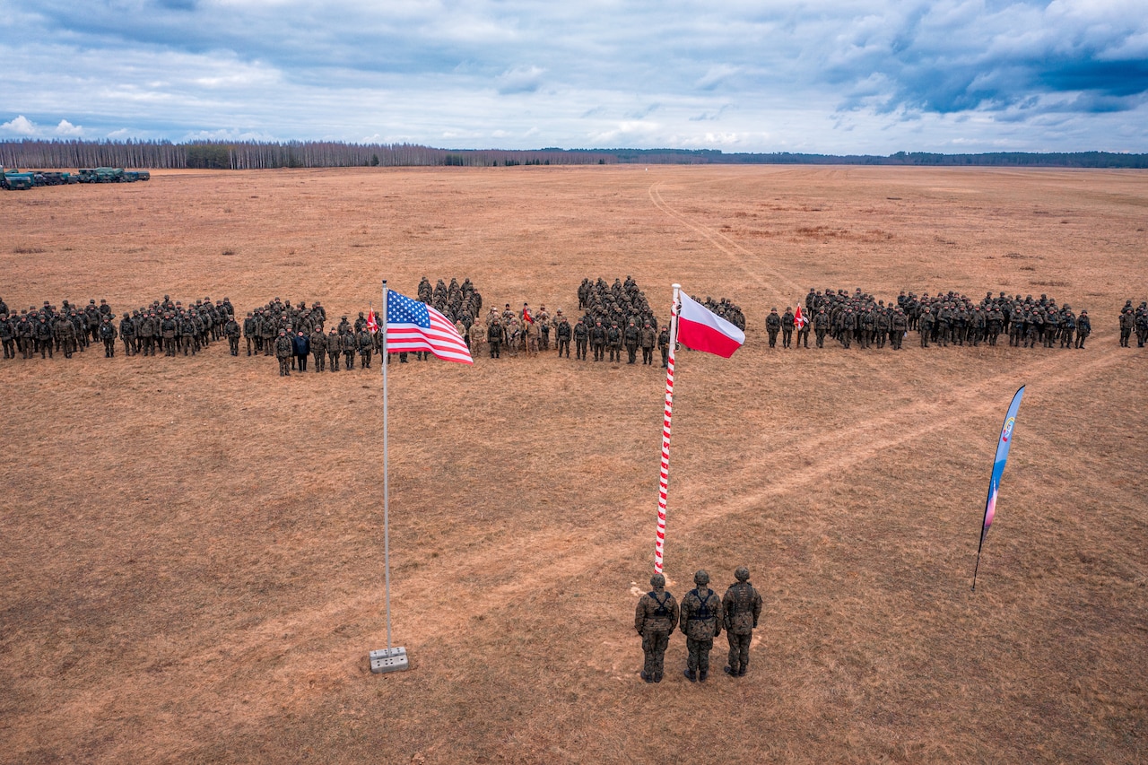 Soldiers stand in formation.