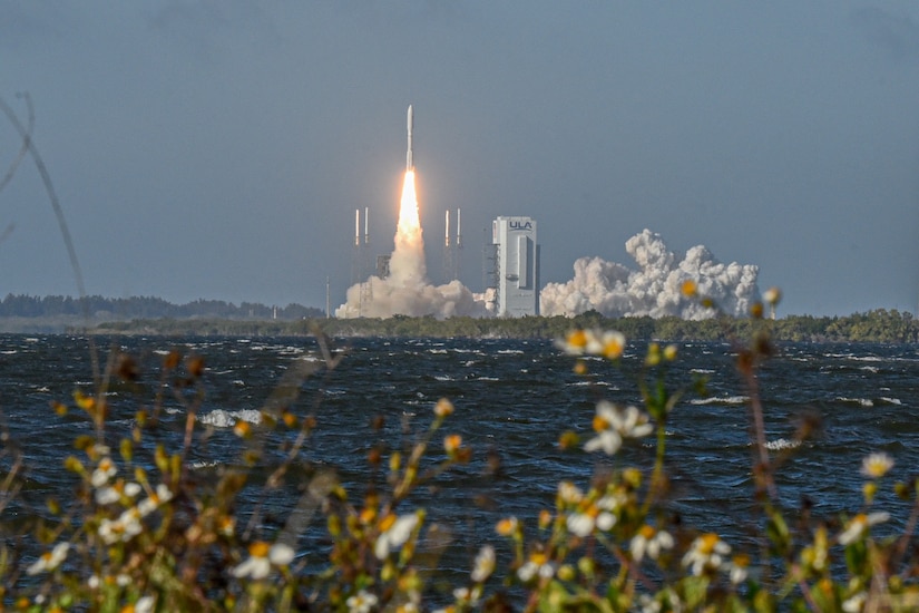 A rocket takes off from a launchpad.