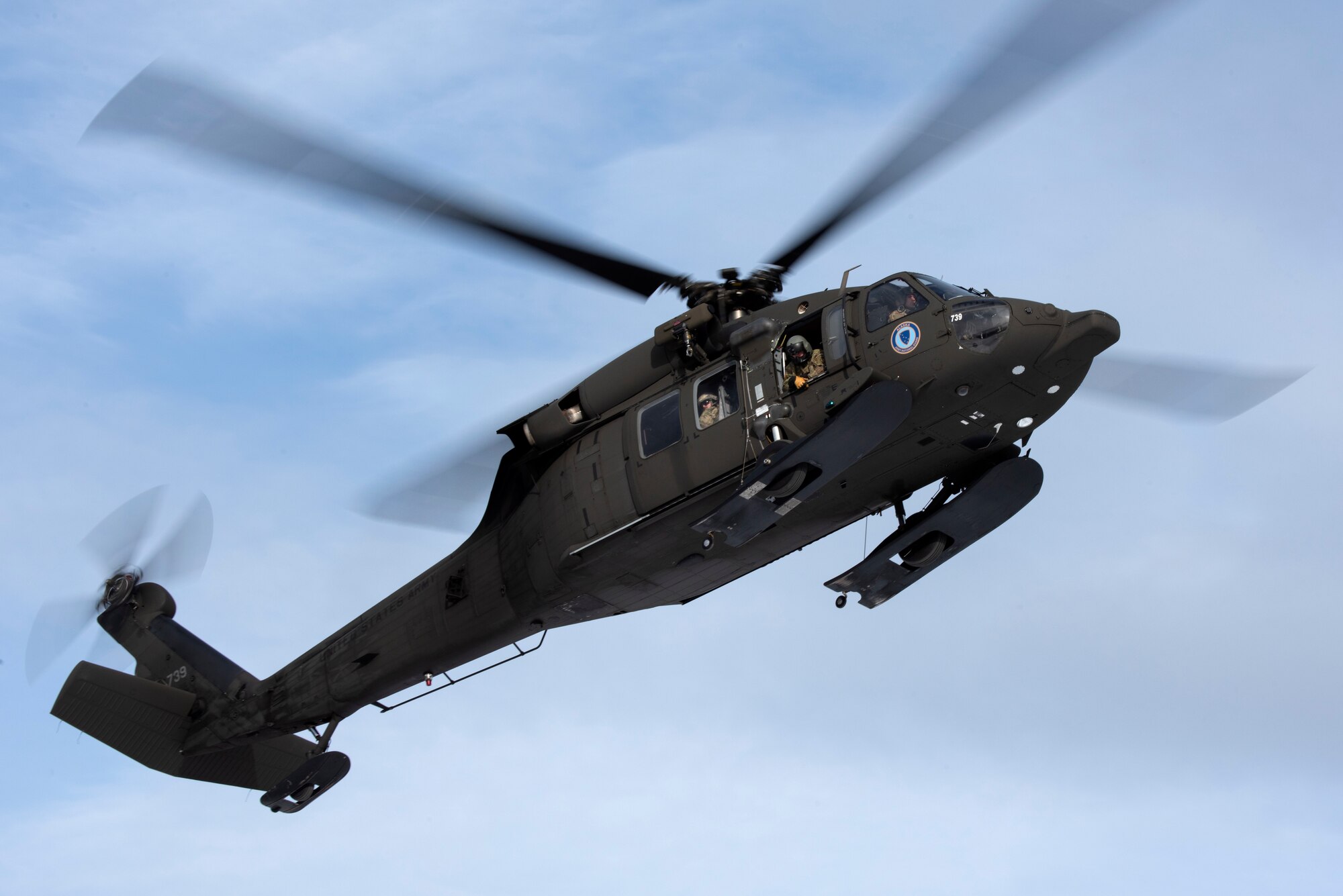 A UH-60 Blackhawk approaches a landing zone.