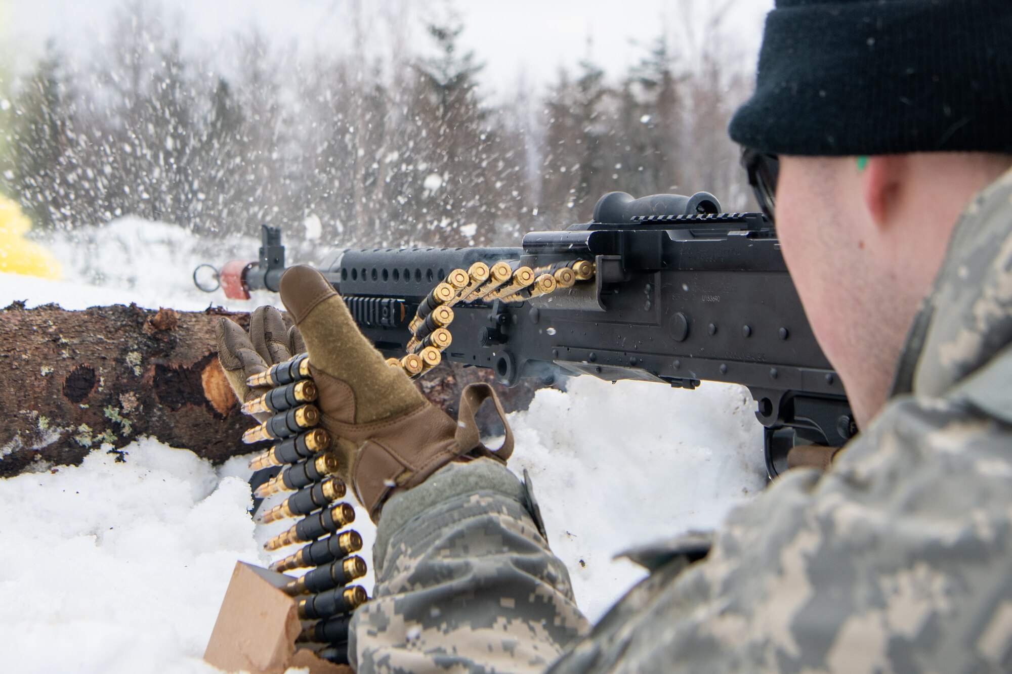 A guardsmen defends an arctic fighting position during a joint operations field training exercise at Camp Mad Bull.