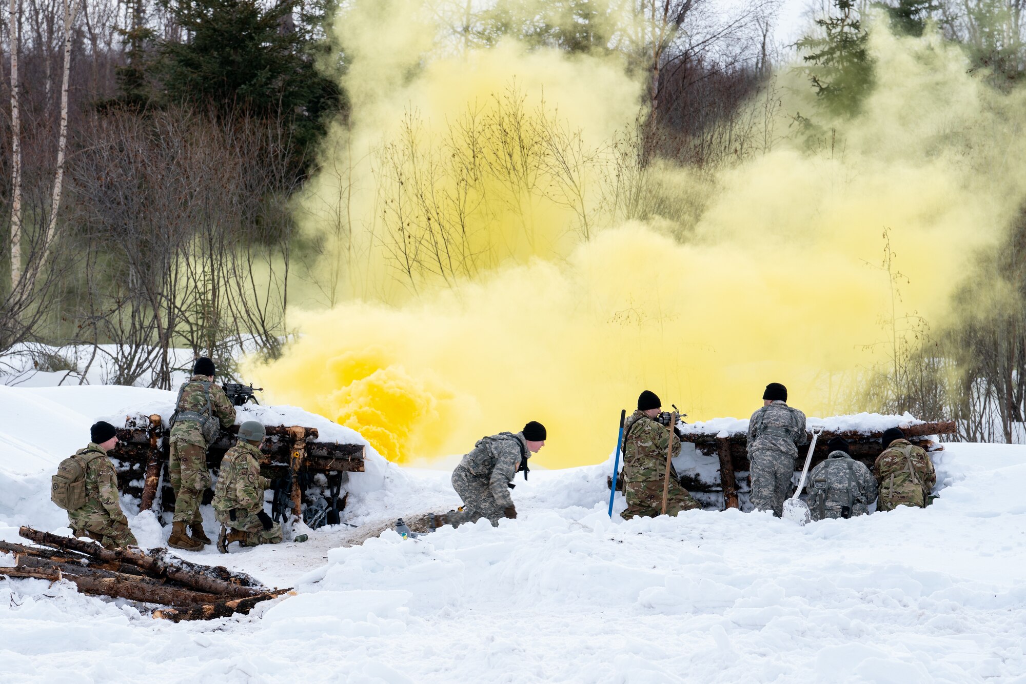 Airmen and Alaska Army National Guardsmen defend an arctic fighting position.