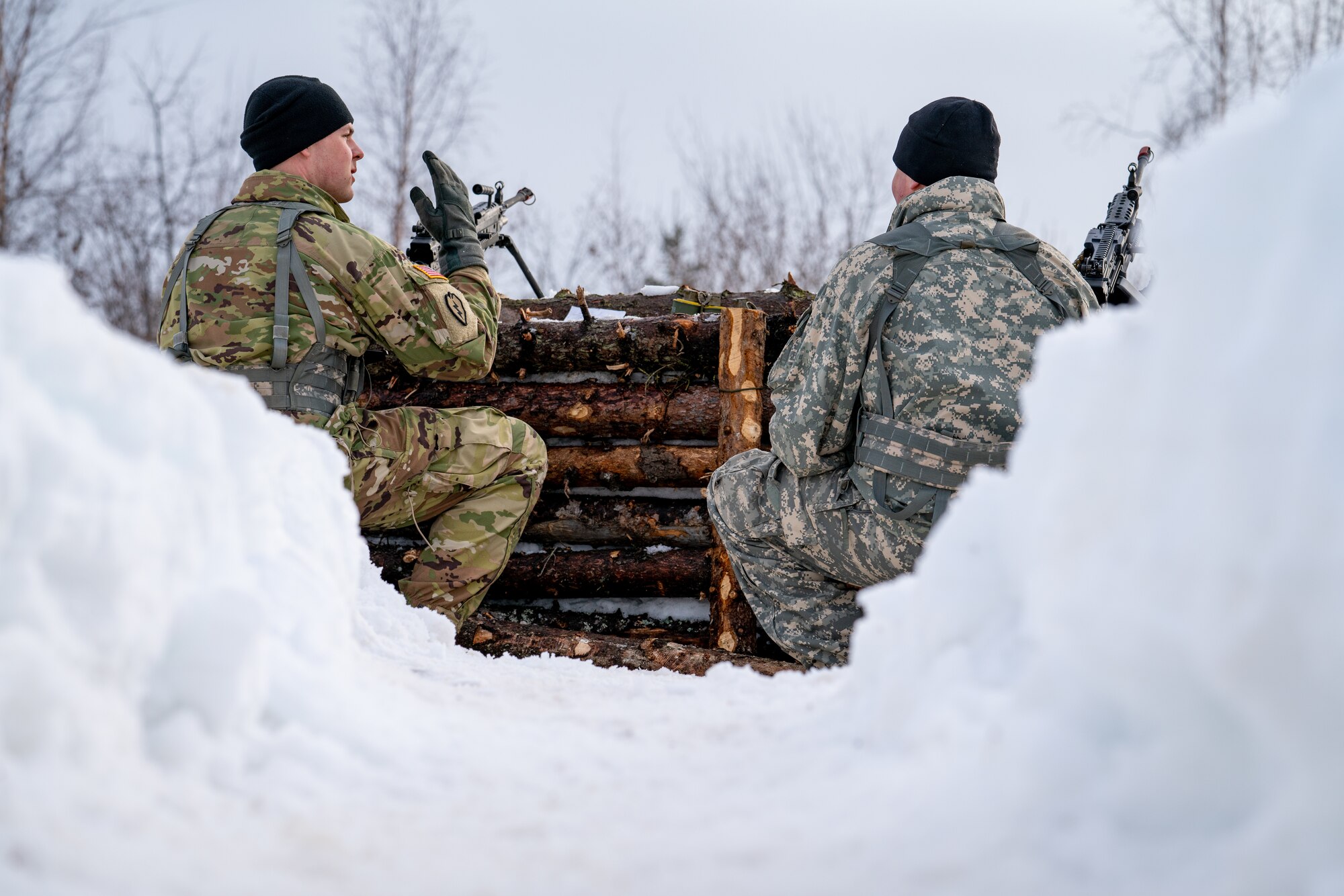 Guardsmen assigned to the 207th Engineer Utility Detachment defend an arctic fighting position during a joint operations field training exercise at Camp Mad Bull.