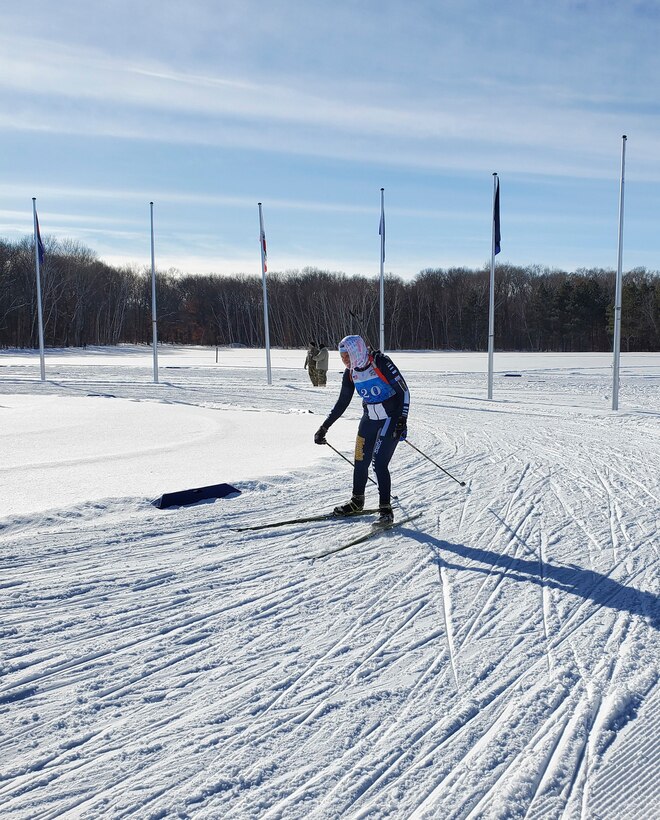 Alaska National Guard 1st Sgt. Angela Horn skis to the finish during the Annual Chief of the National Guard Biathlon Race on Camp Ripley, Minnesota, from Feb. 12-15, 2022. The AKNG team took first place overall in the women's division during this year's competition. (Courtesy photo)