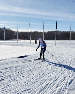 Alaska National Guard 1st Sgt. Angela Horn skis to the finish during the Annual Chief of the National Guard Biathlon Race on Camp Ripley, Minnesota, from Feb. 12-15, 2022. The AKNG team took first place overall in the women's division during this year's competition. (Courtesy photo)